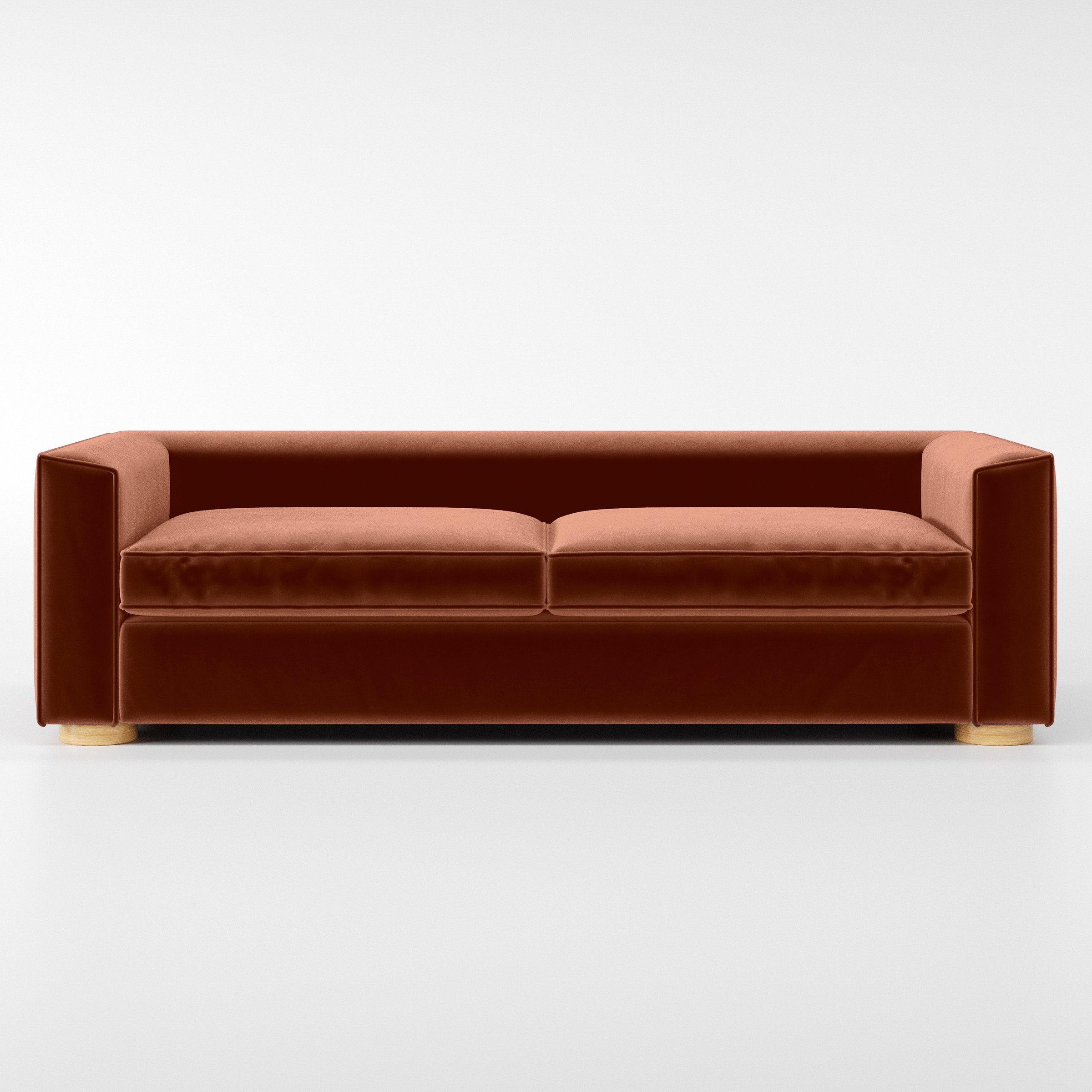 Front view of the Feale sofa upholstered in Plush EasyClean Velvet in Apricot.