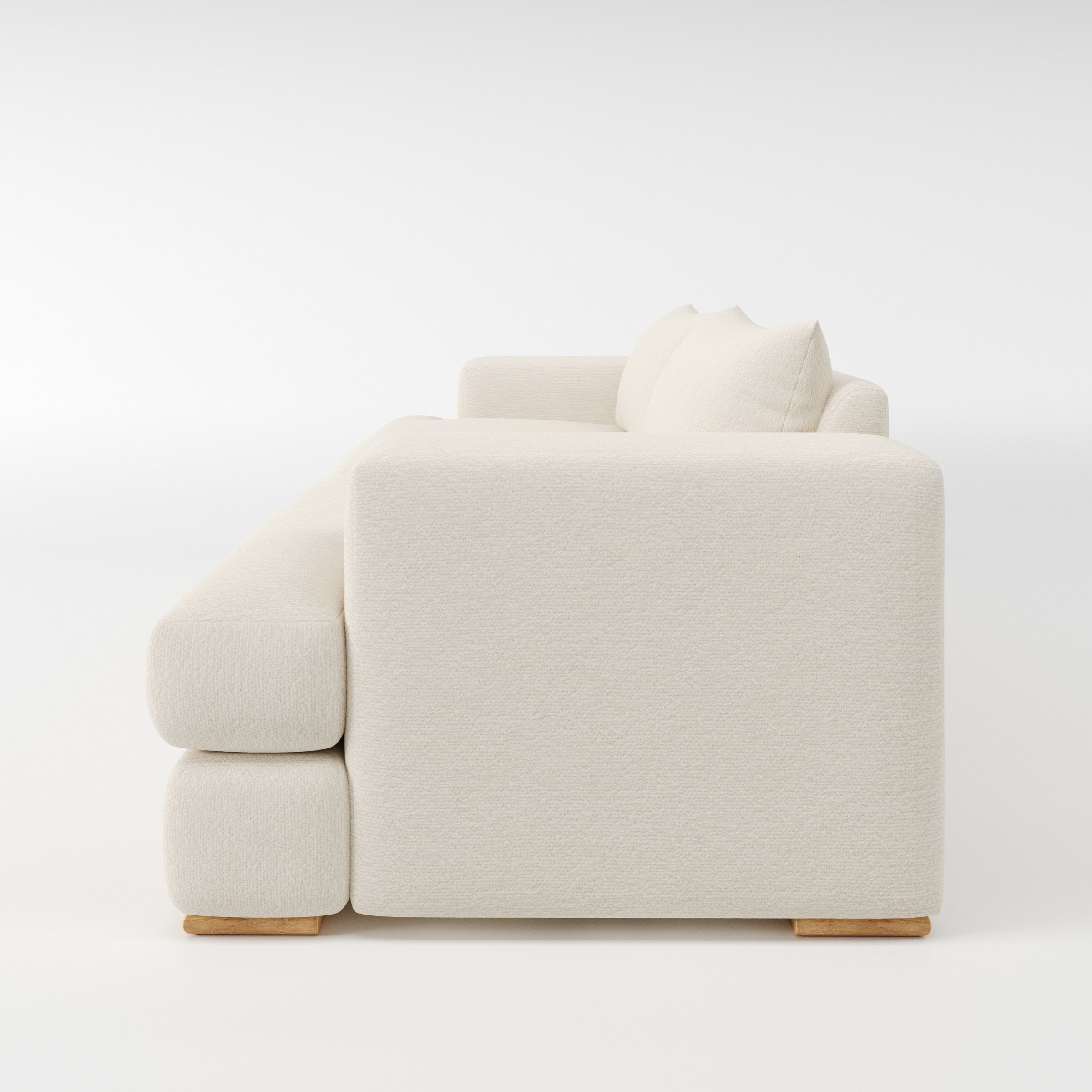 Fane sofa in Kilda Boucle Cream shown in side profile displaying proportions and overall silhouette.