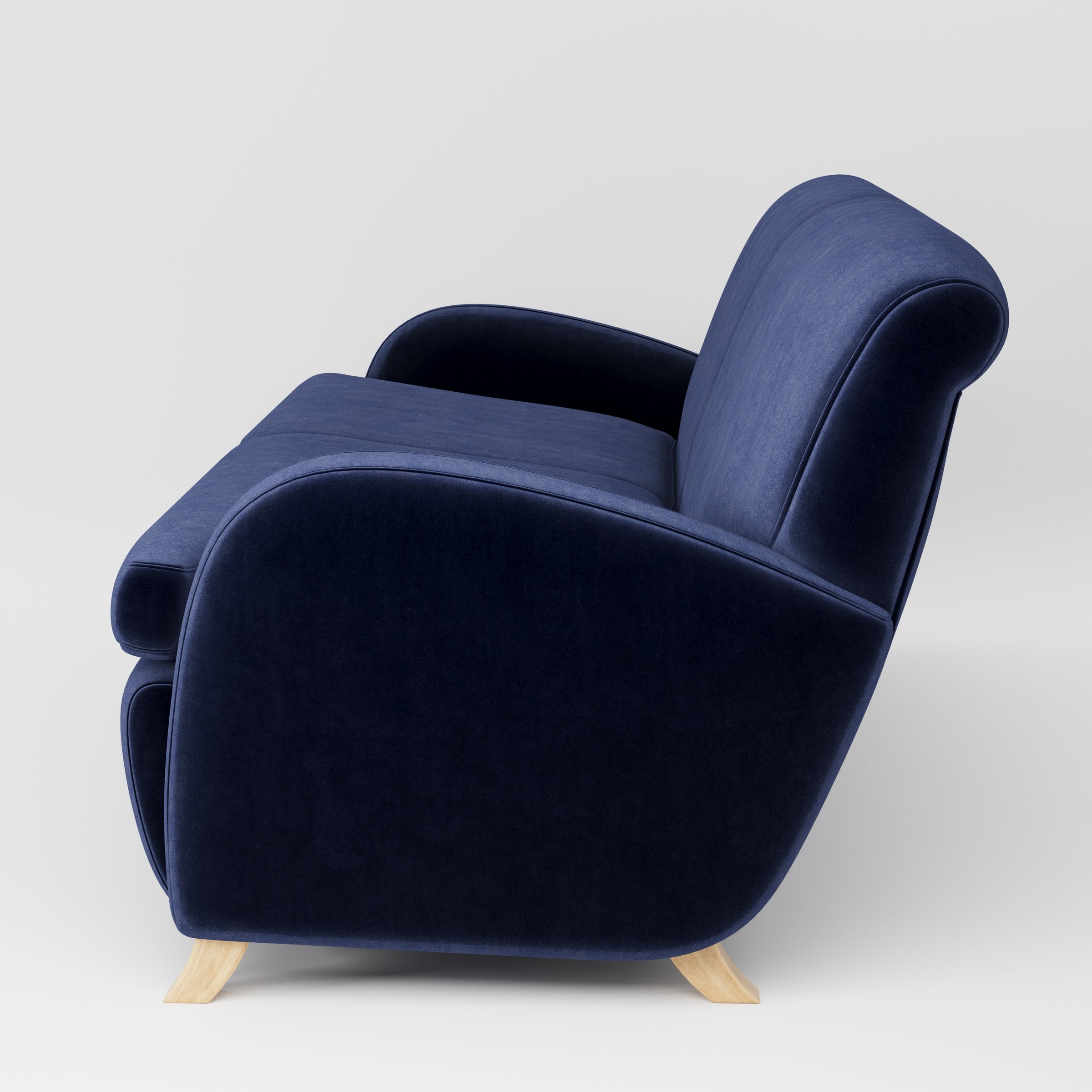 Rye sofa in Noss Velvet Navy shown in side profile displaying proportions and overall silhouette.