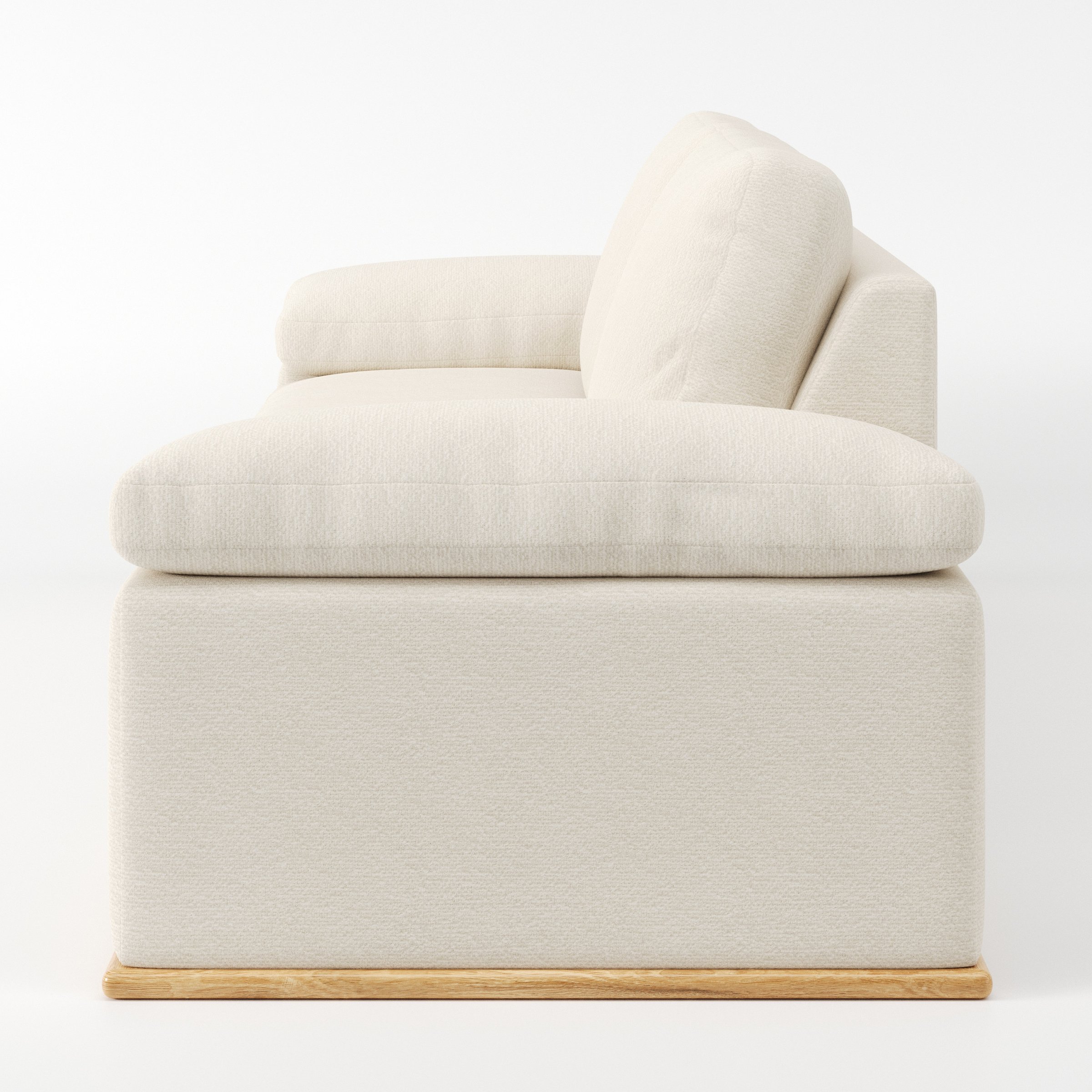 Cusher sofa in Kilda Boucle Cream shown in side profile displaying proportions and overall silhouette.