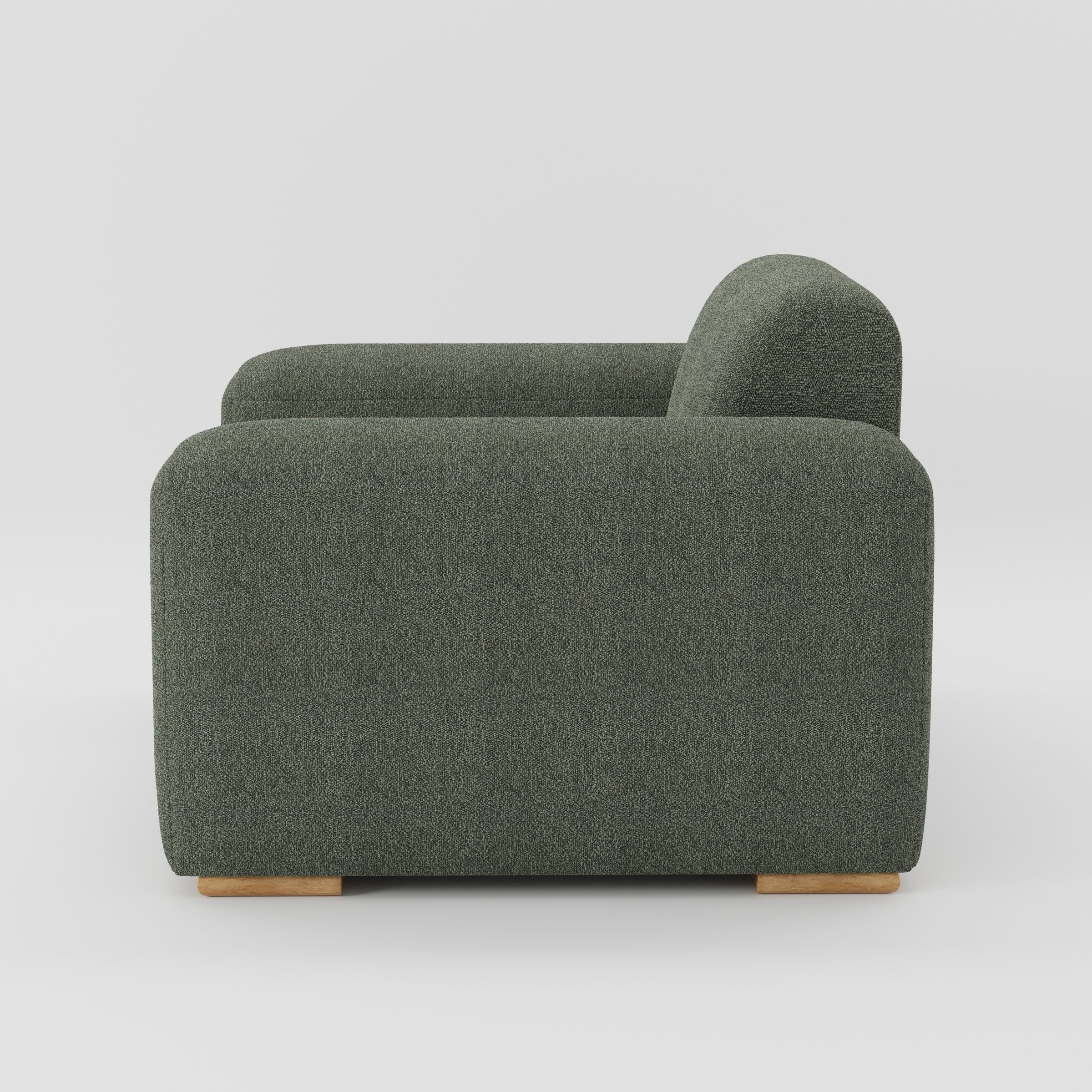 Darwell armchair in Kilda Boucle Moss shown in side profile displaying proportions and overall silhouette.