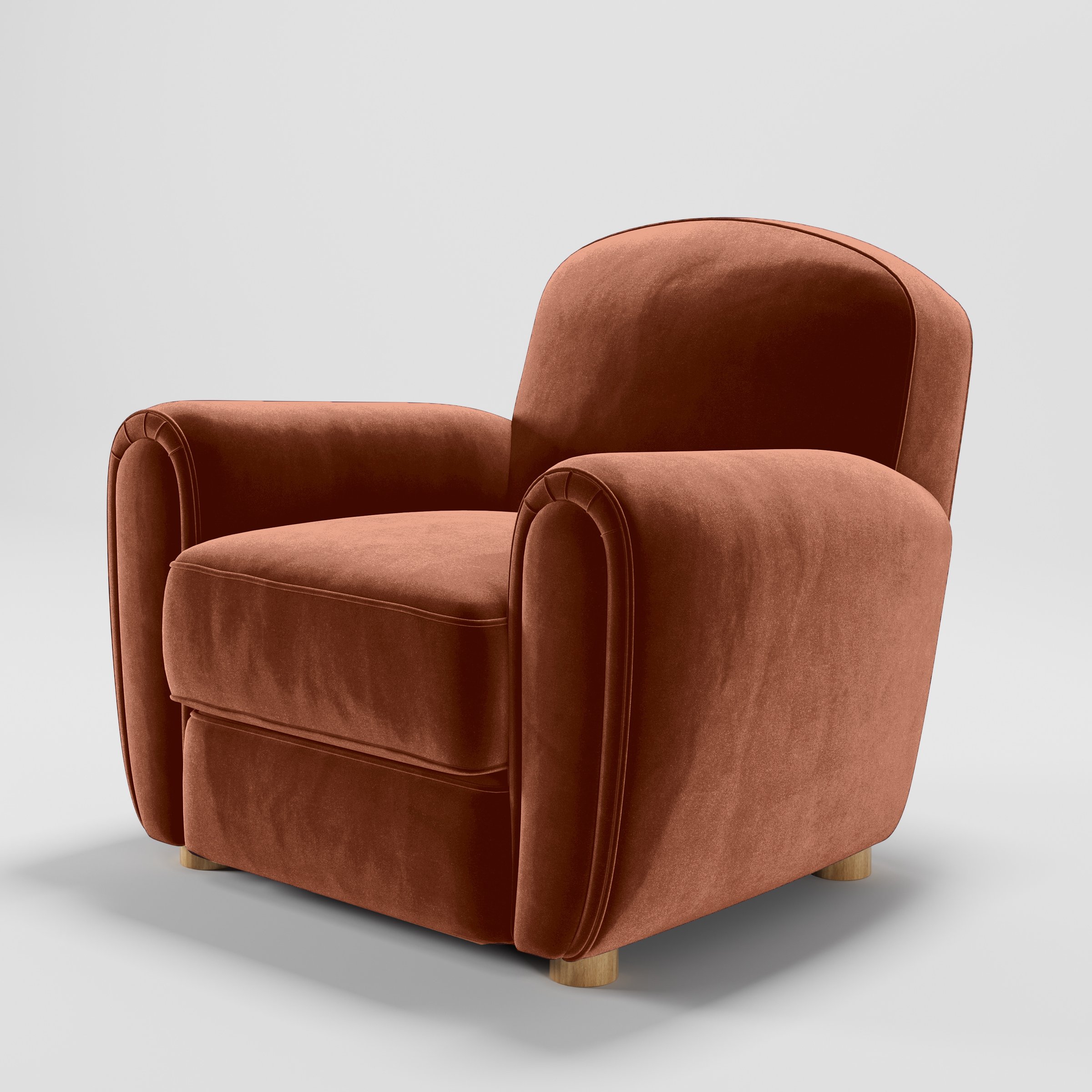 Diagonal view of the Fergus armchair upholstered in Plush EasyClean Velvet in Apricot.