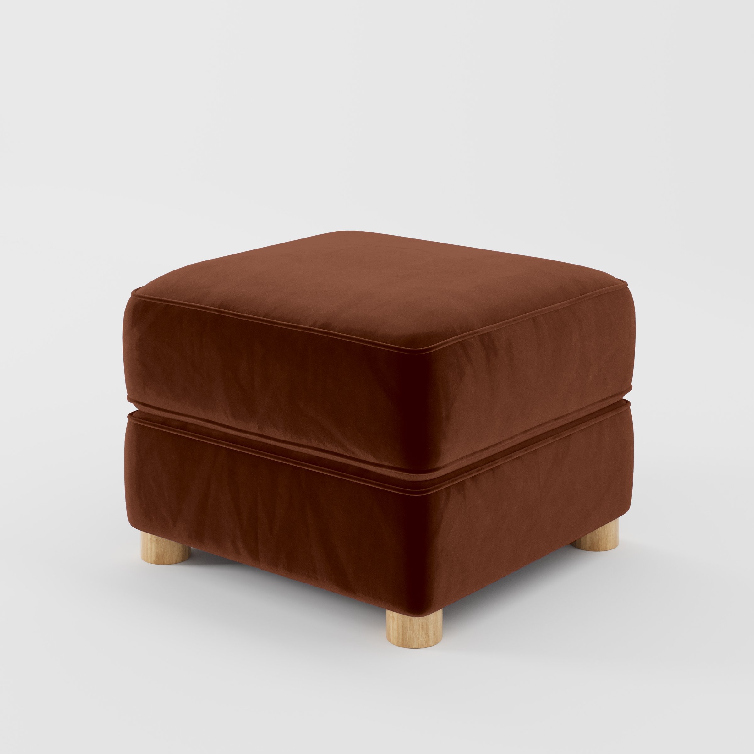 Diagonal view of the Fergus footstool upholstered in Plush EasyClean Velvet in Maple.