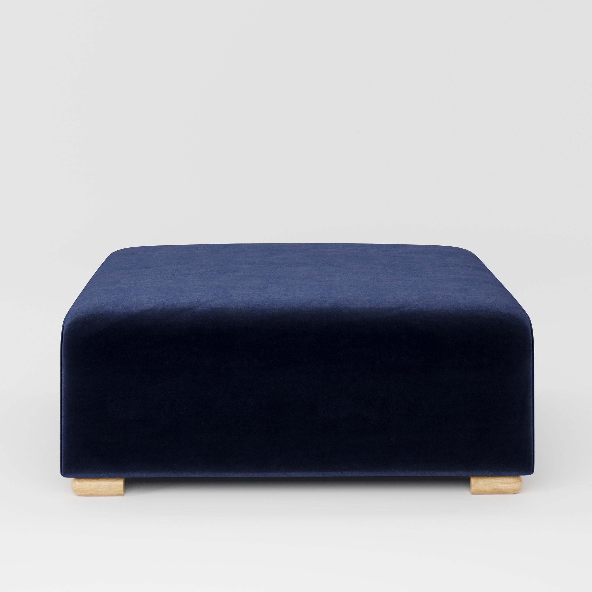 Tay footstool in Noss Velvet Navy shown front-on against a neutral studio backdrop.