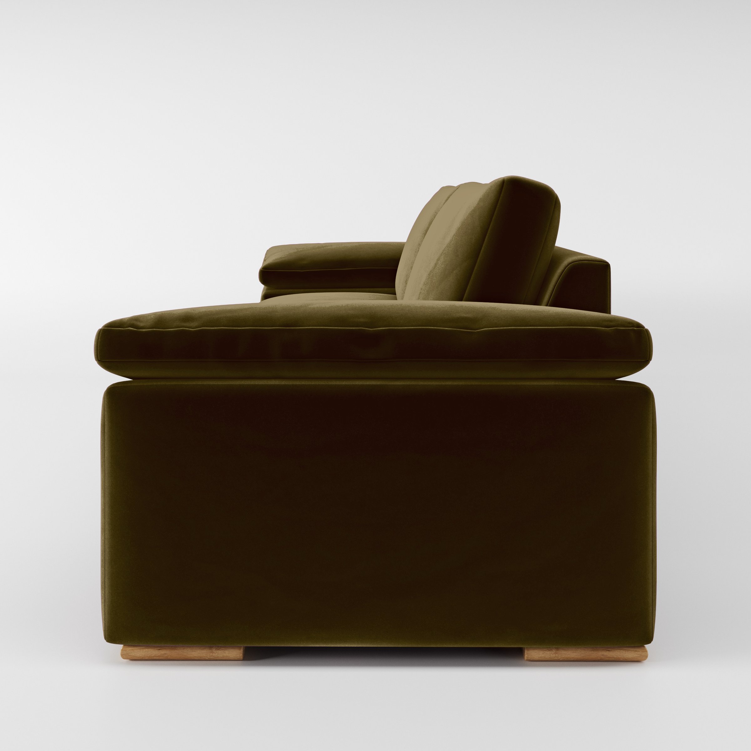 Side view of the Moy sofa upholstered in Plush EasyClean Velvet in Cedar.