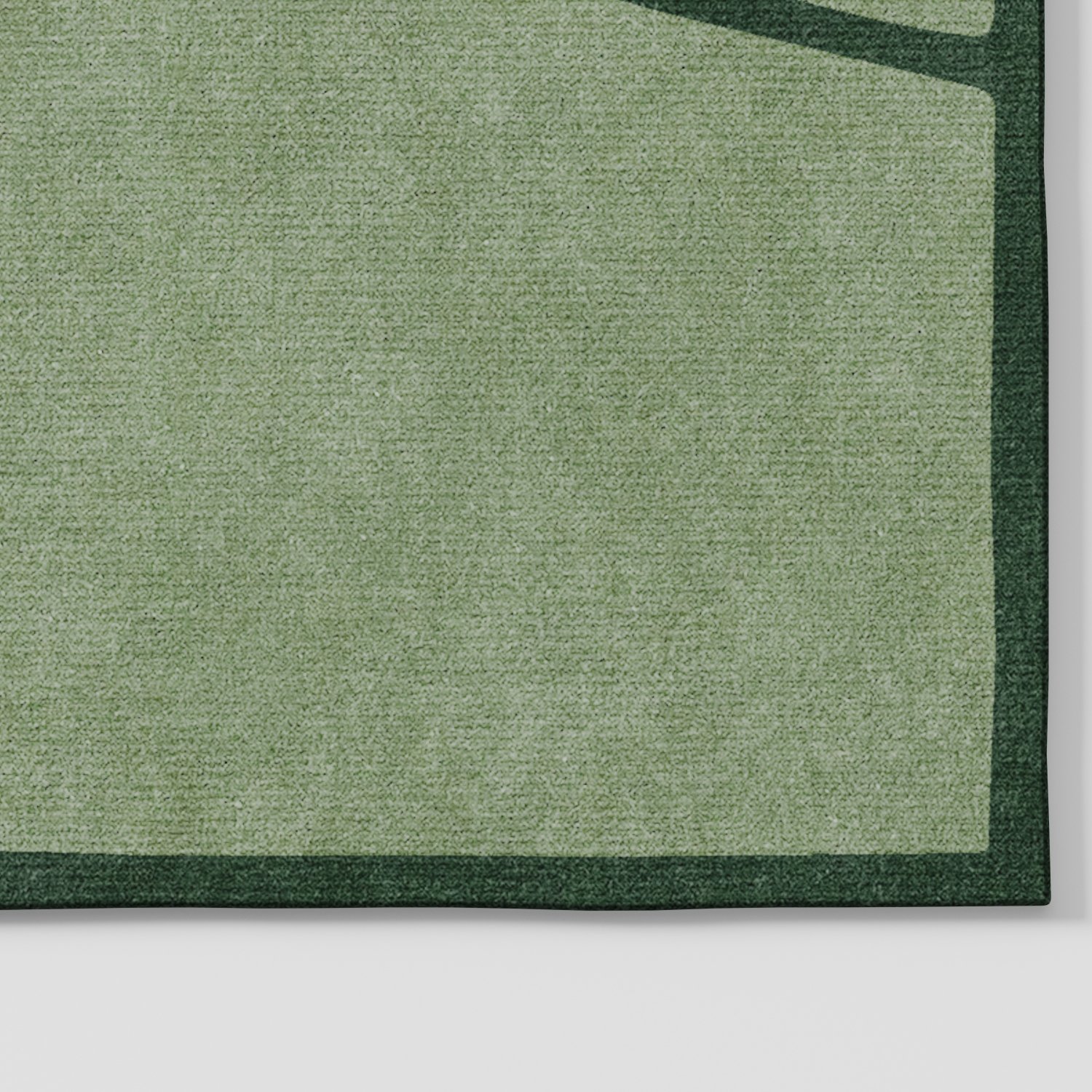 Marl rug in soft green tones with abstract linear geometric pattern, angled corner detail highlighting linework and consistent low pile surface, hand tufted wool and viscose blend