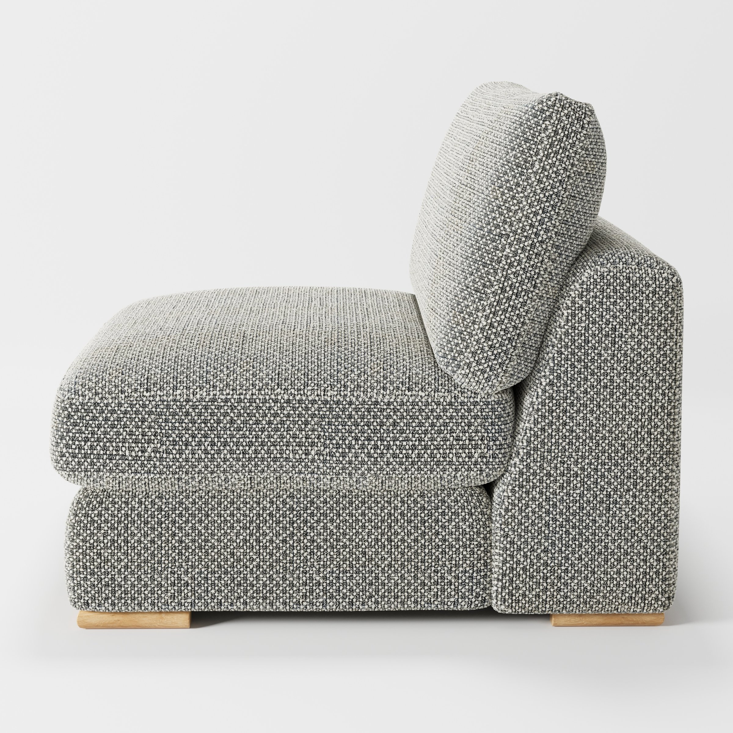 Olton single sofa unit in Rousay Wool Blend Tar and Chalk shown from the side showing the layered seat cushion and angled back cushion with timber feet.