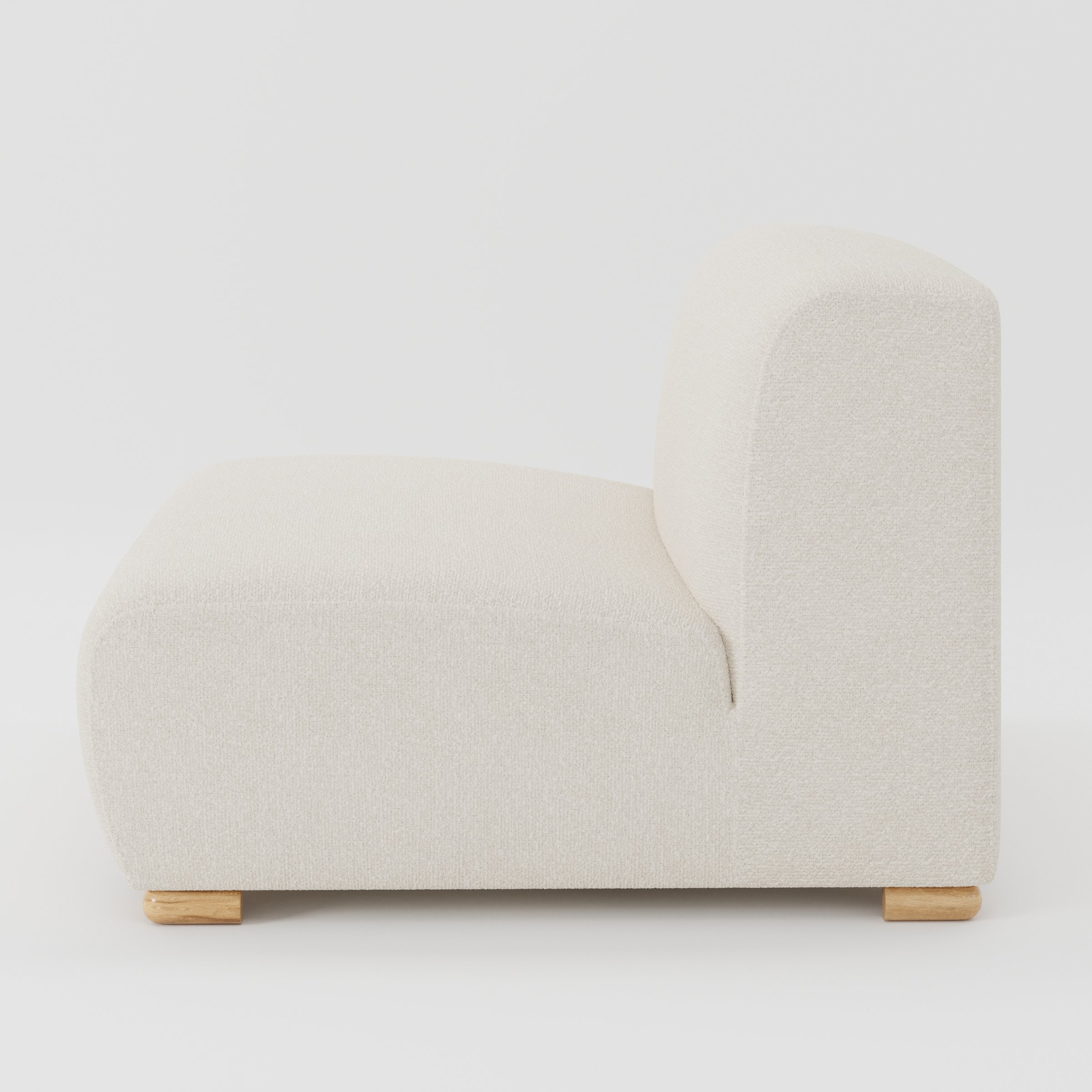 Tay single sofa unit in Kilda Bouclé Cream shown from the side showing the low backrest, deep seat and timber feet.