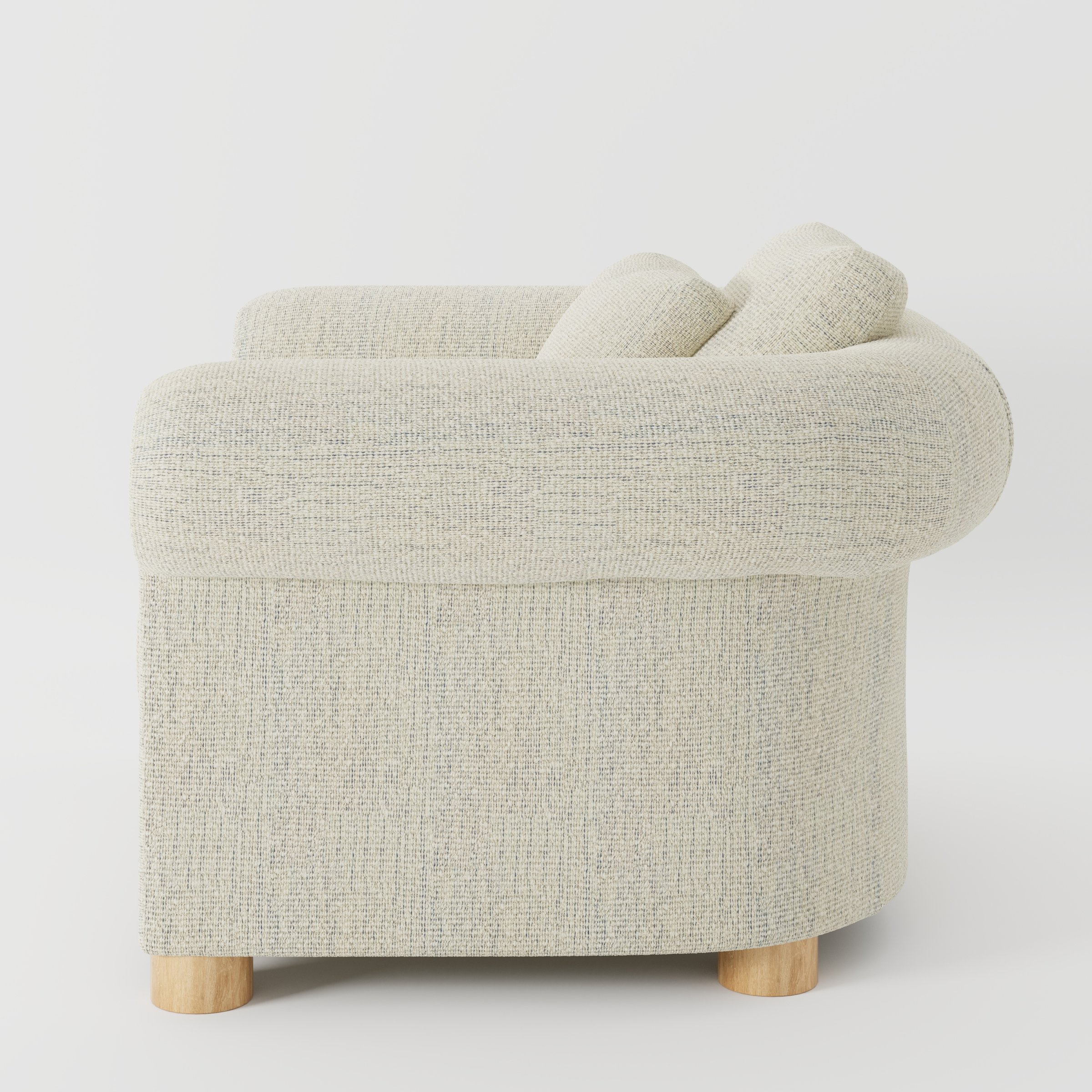 Windermere armchair in Orsay Boucle Cream and Marine shown in side profile displaying proportions and overall silhouette.