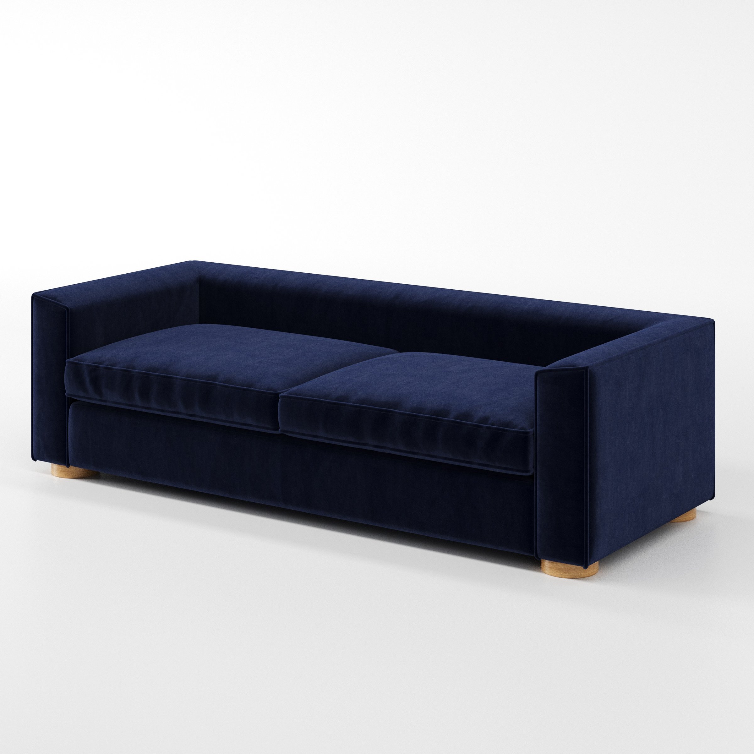 Feale sofa in Noss Velvet Navy shown at a diagonal angle highlighting arm profile and seat depth.