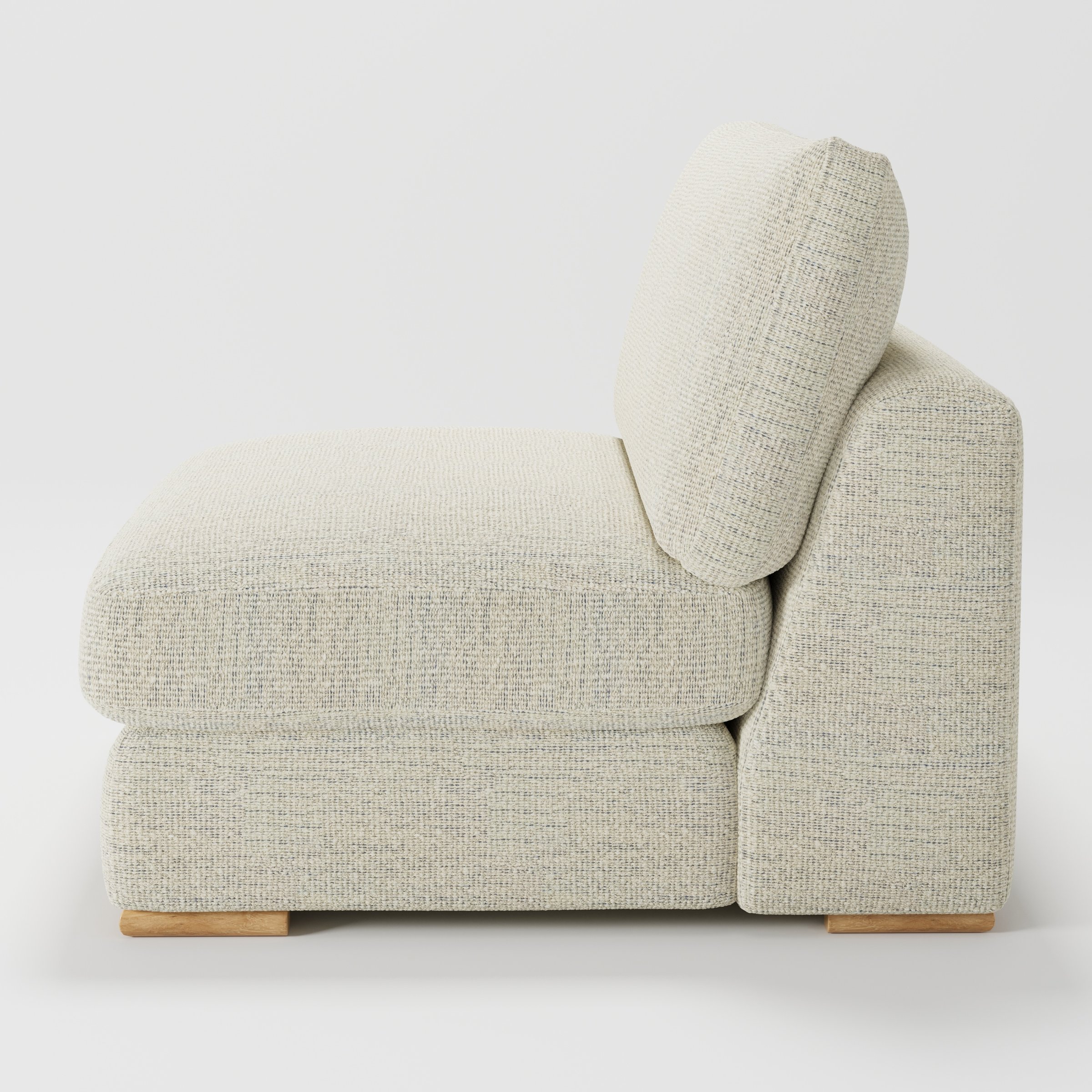 Olton single sofa unit in Orsay Bouclé Cream and Marine shown from the side showing the layered seat cushion and angled back cushion with timber feet.