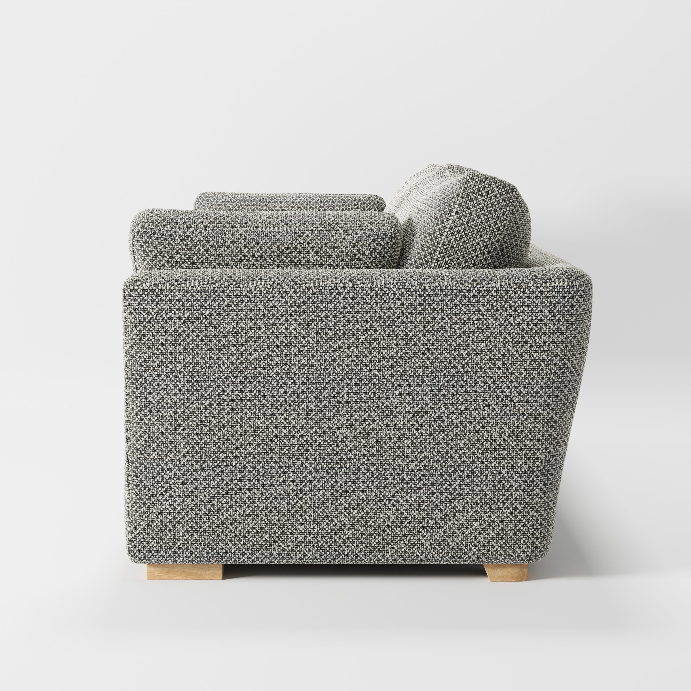 Stowe sofa in Rousay Wool Blend Tar and Chalk shown in side profile displaying proportions and overall silhouette.