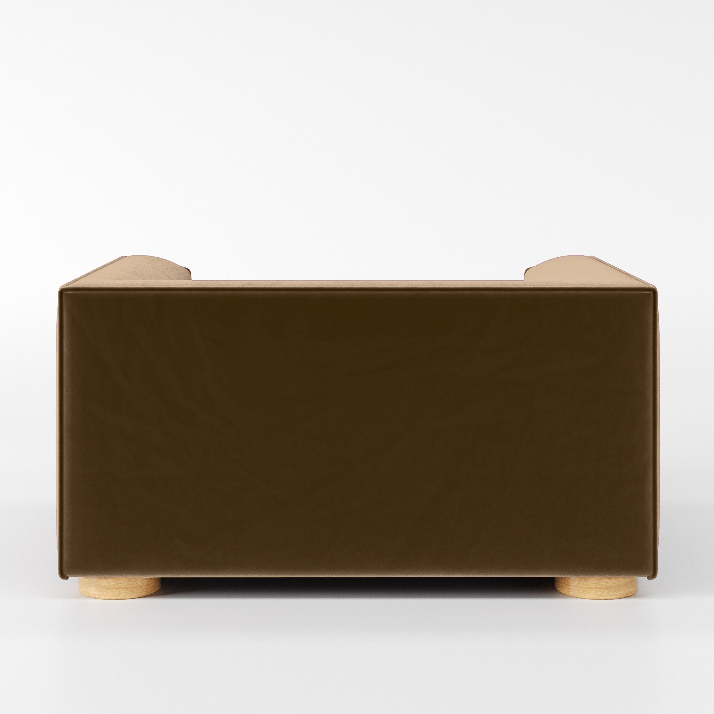 Rear view of the Feale armchair upholstered in Plush EasyClean Velvet in Caribou.
