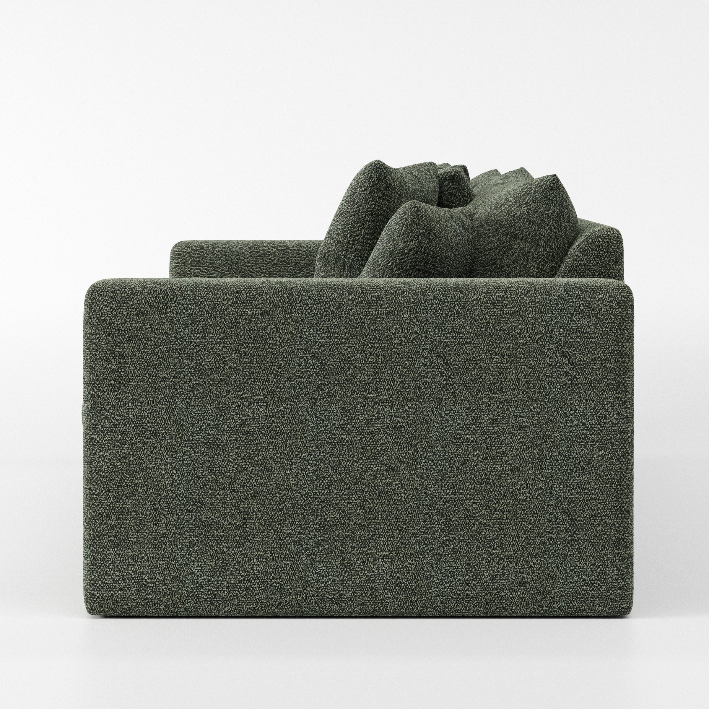 Coniston sofa in Kilda Boucle Moss shown in side profile displaying proportions and overall silhouette.
