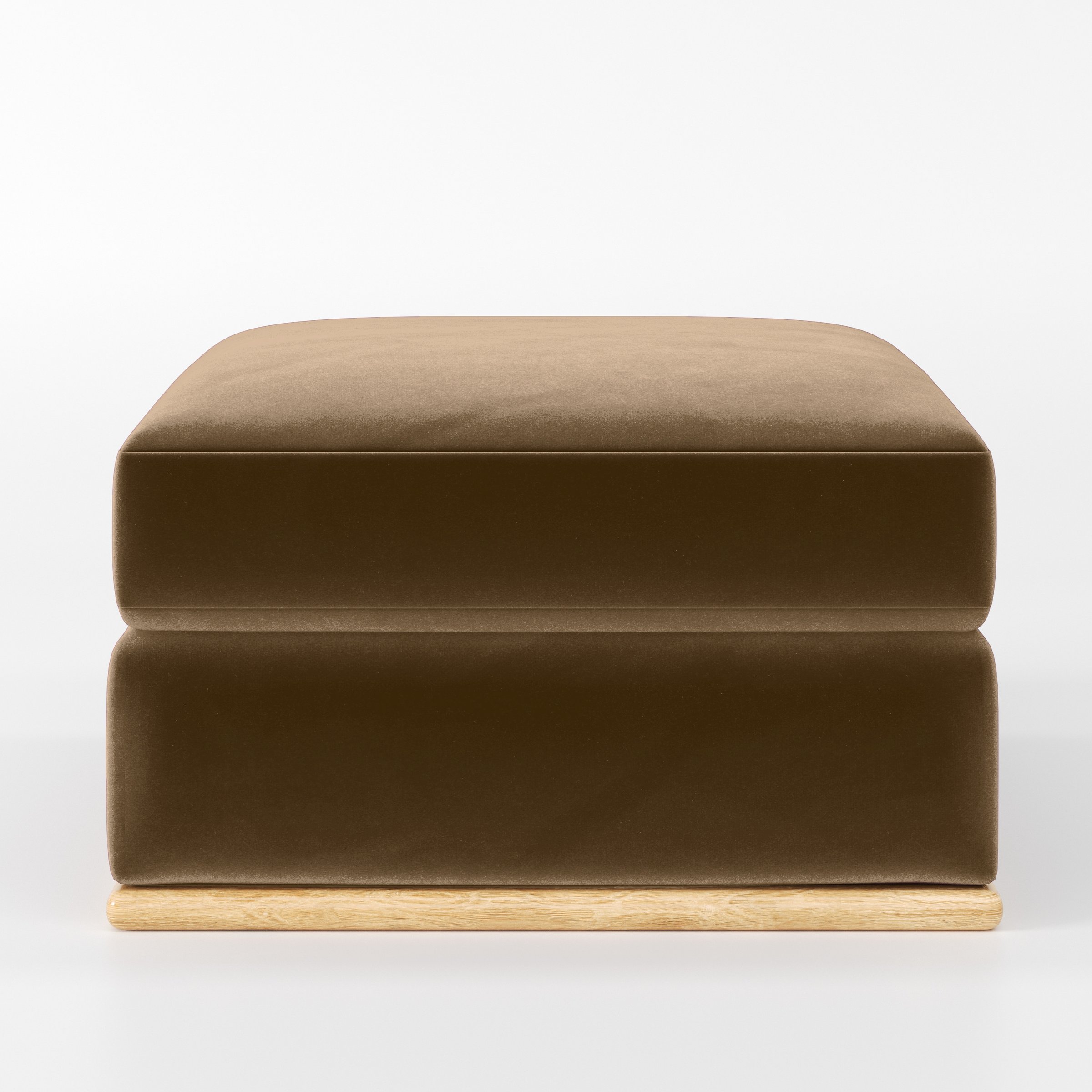 Front view of the Cusher footstool upholstered in Plush EasyClean Velvet in Caribou.