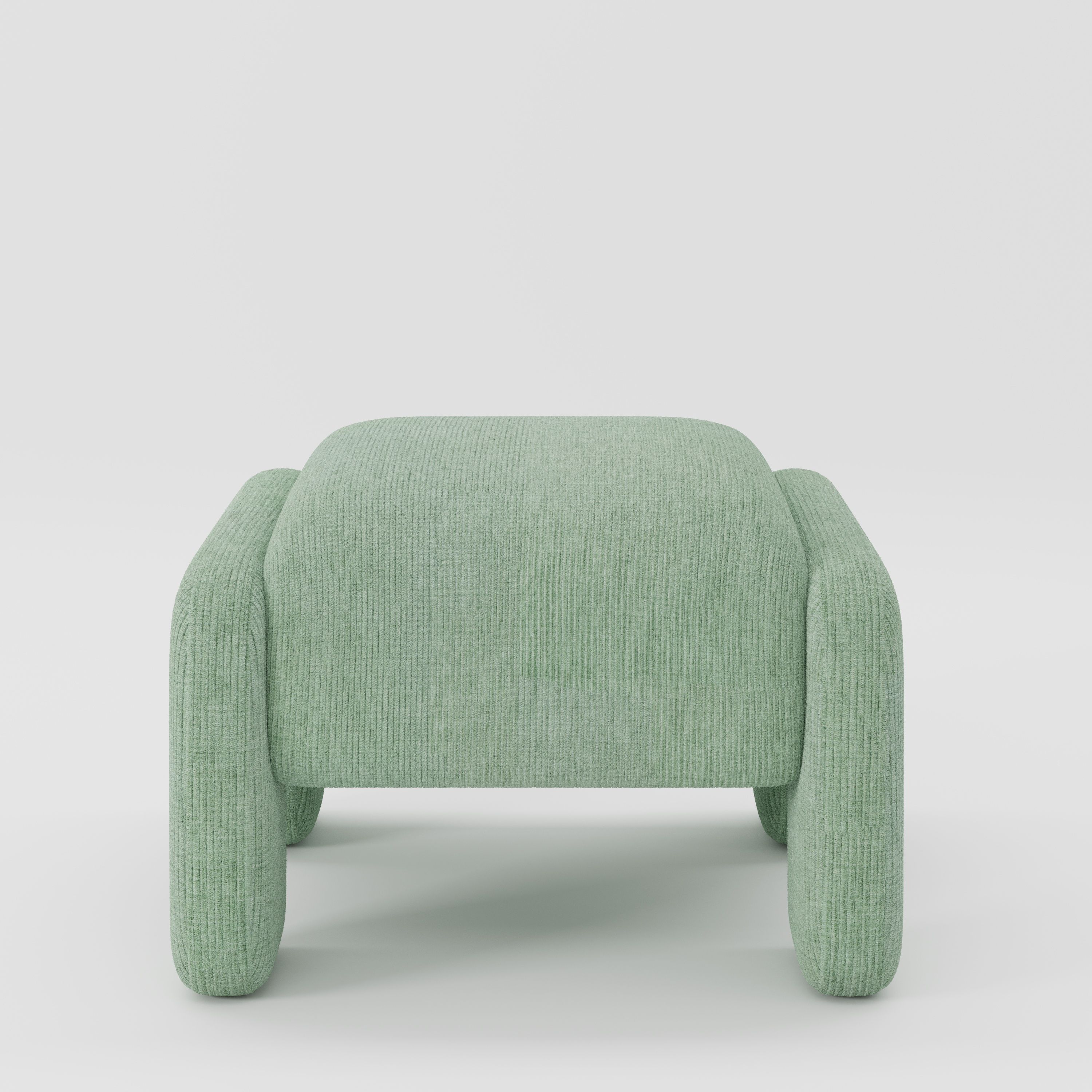 Inny footstool in Caldey velvet corduroy eucalyptus fabric, front view showing sculpted form and fine ribbed texture