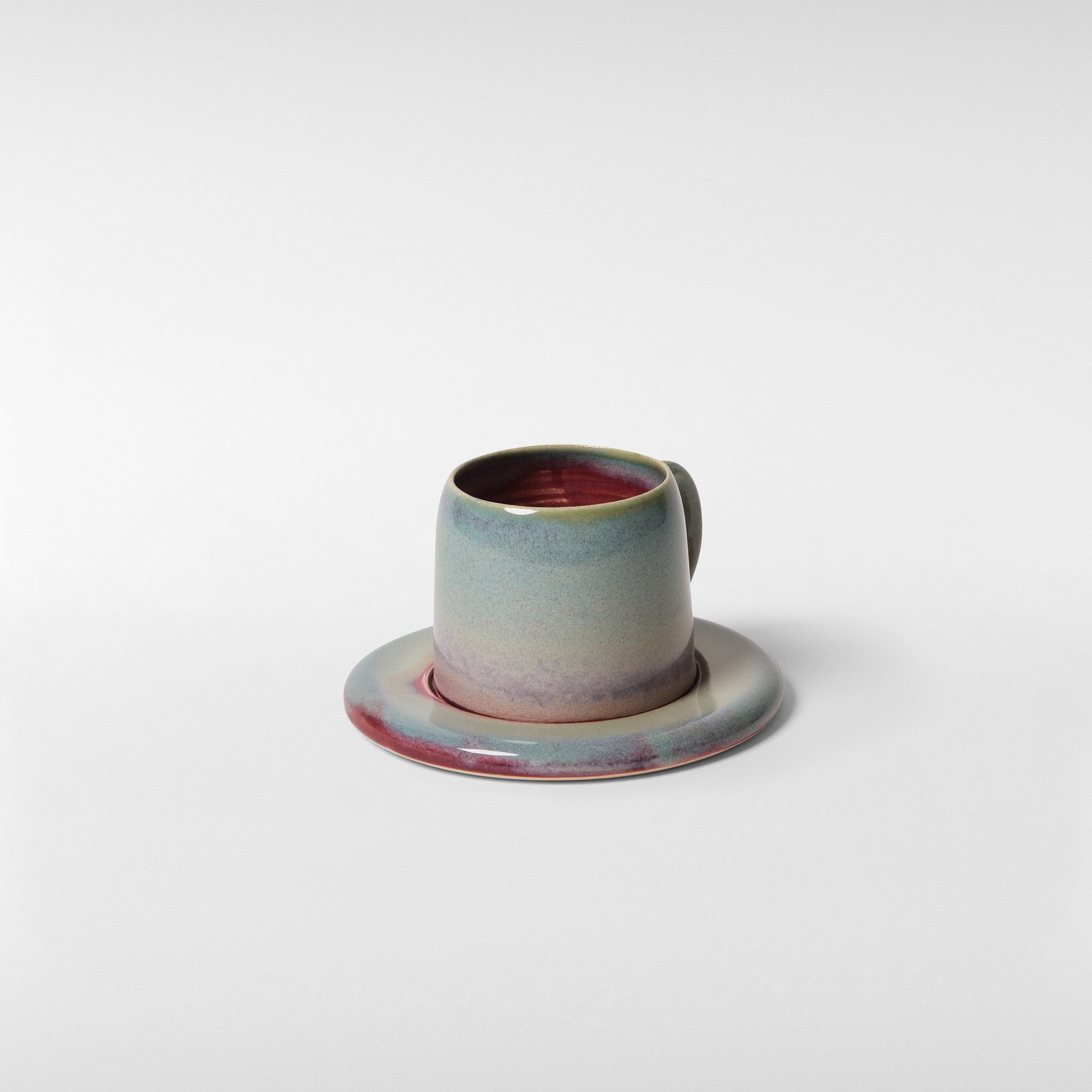 Loam glazed ceramic cup and saucer set, side angle showing sculpted profile, handle detail and subtle colour variation