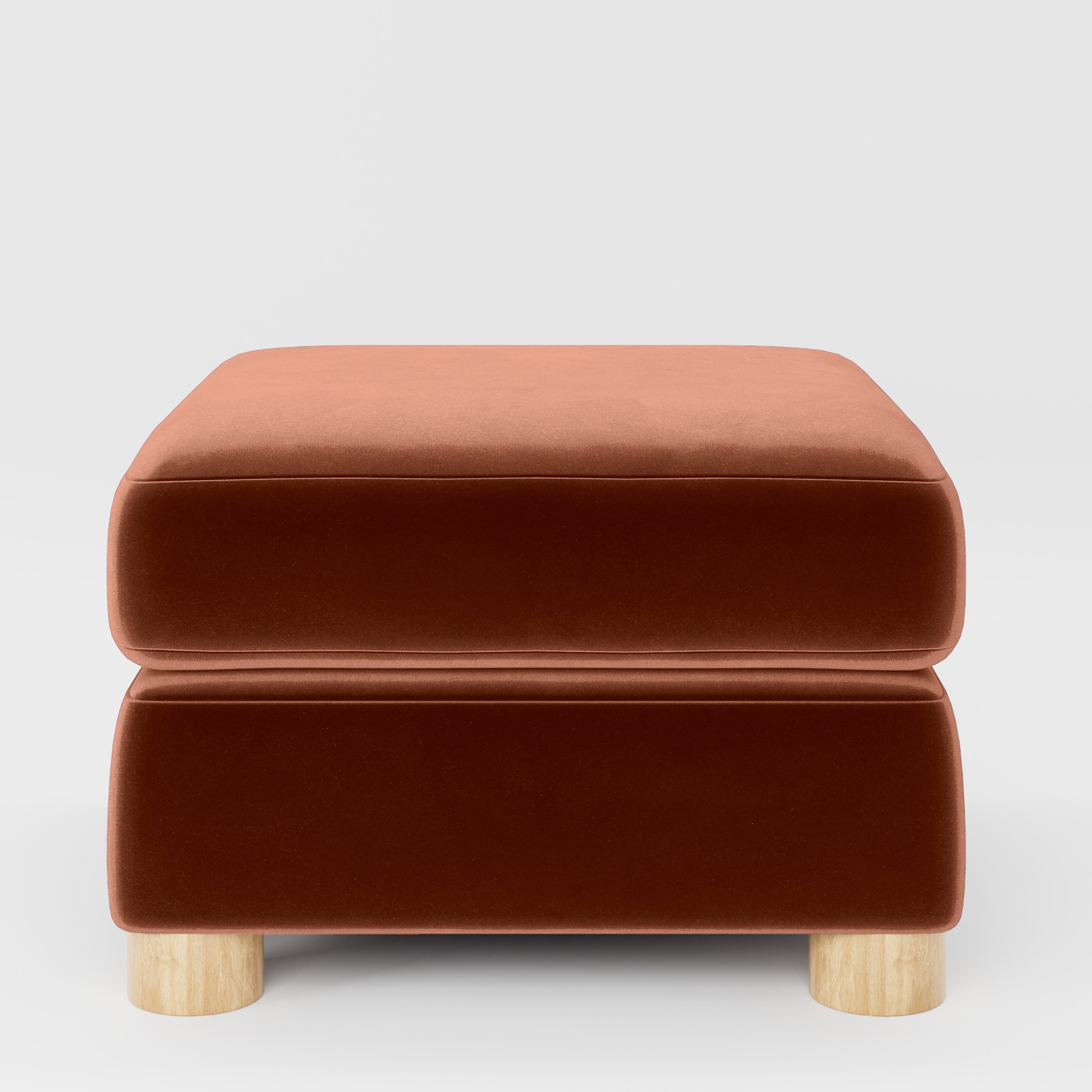 Front view of the Windermere footstool upholstered in Plush EasyClean Velvet in Apricot.