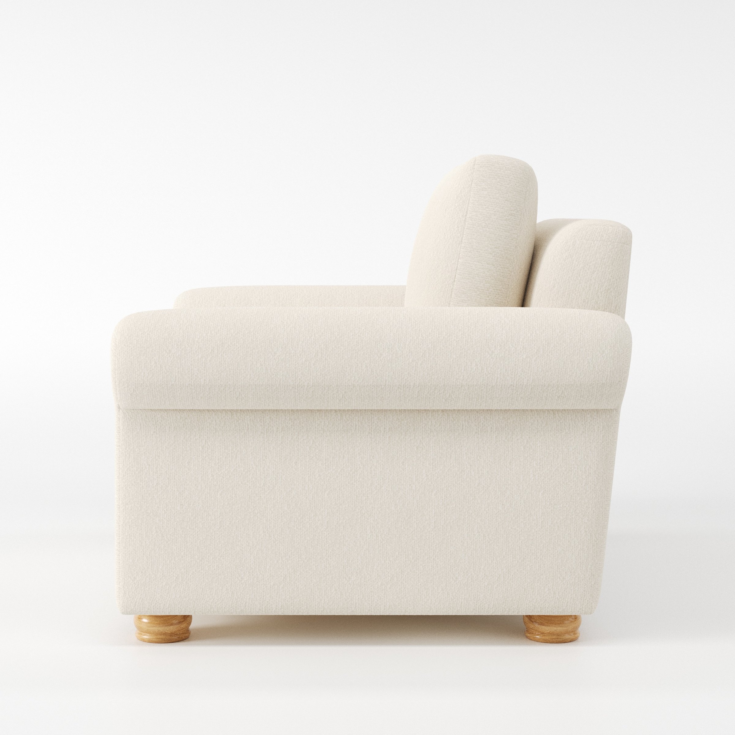 Anna Lee armchair in Kilda Boucle Cream shown in side profile displaying proportions and overall silhouette.
