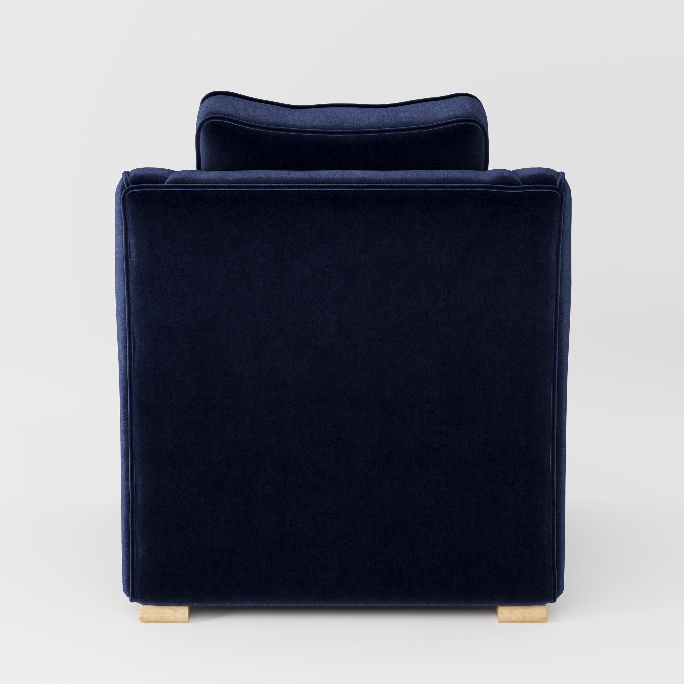 Cashel armchair in Noss Velvet Navy shown from the rear highlighting backrest shape and upholstery finish.