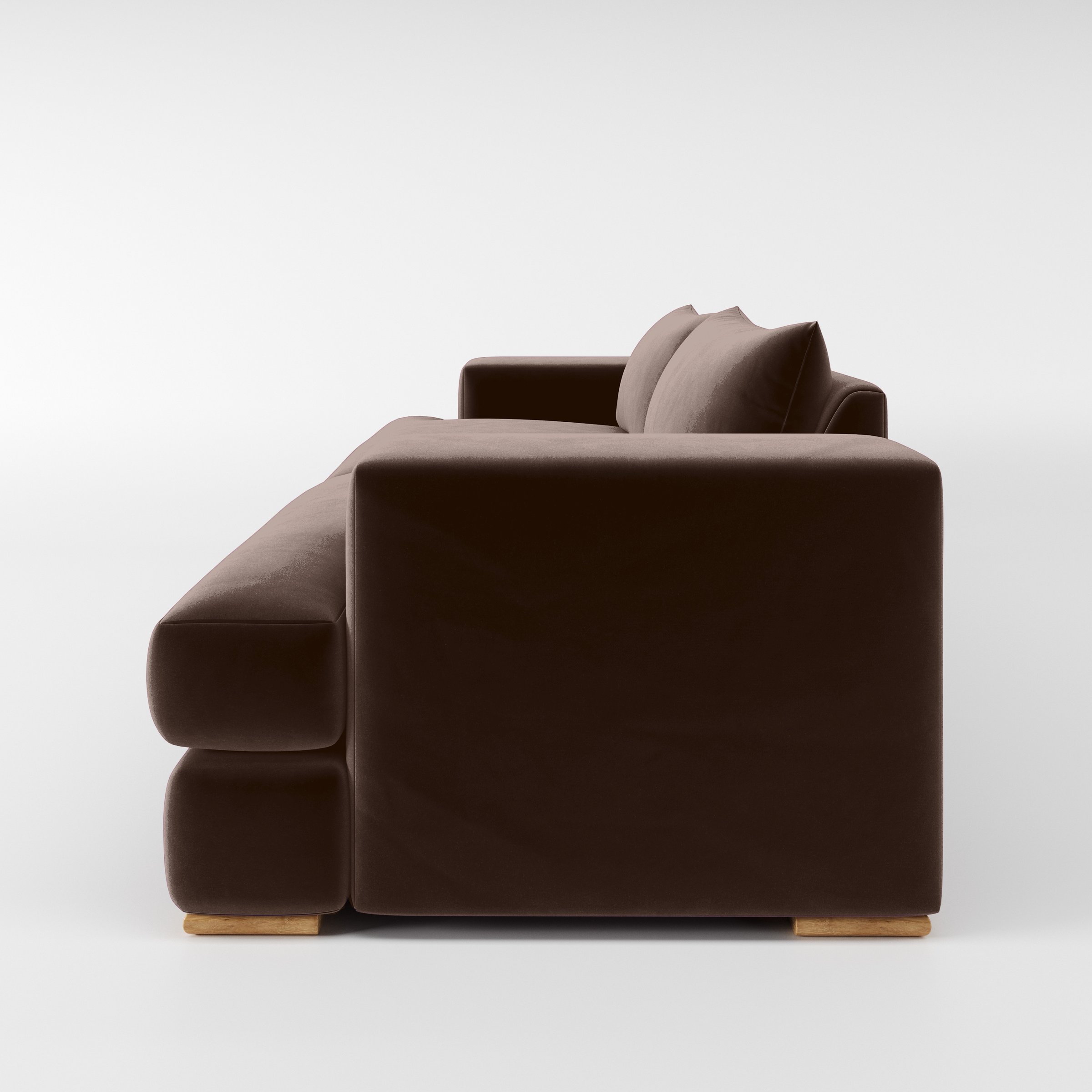 Side view of the Fane sofa upholstered in Plush EasyClean Velvet in Mole.