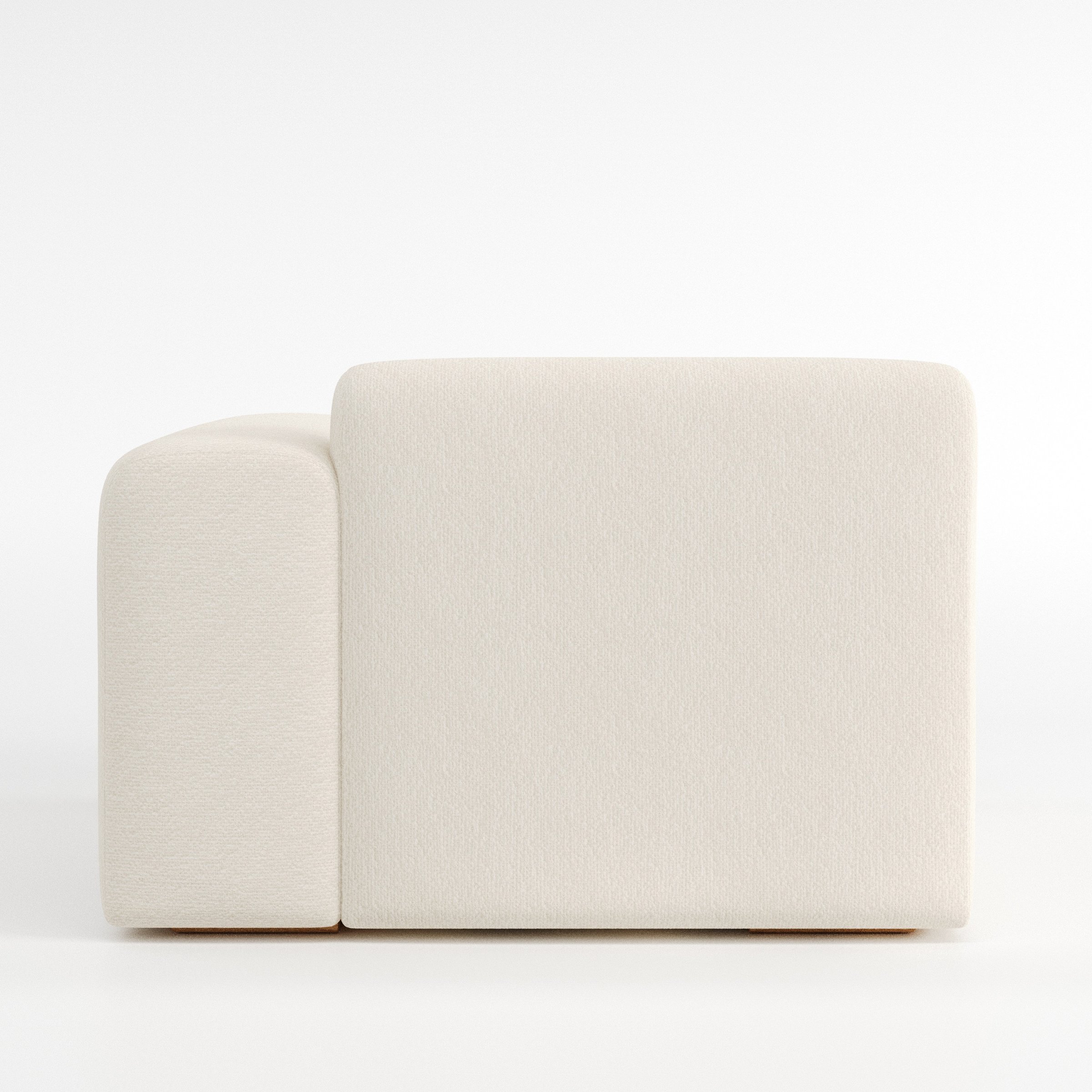 Drumquin modular sofa right side unit in Kilda Bouclé Cream shown from the back with a smooth, softly curved silhouette and armrest edge visible.