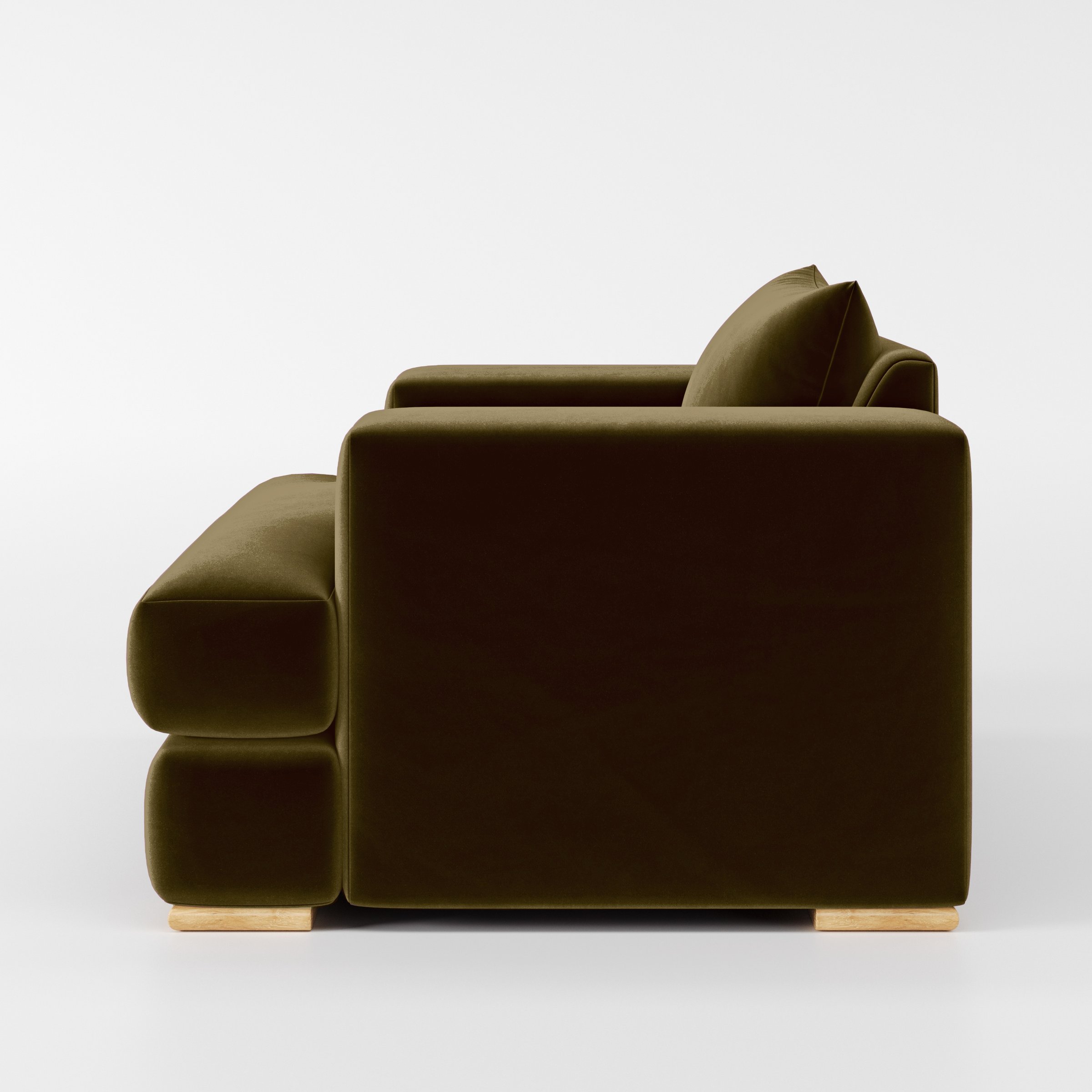 Side view of the Fane armchair upholstered in Plush EasyClean Velvet in Cedar.
