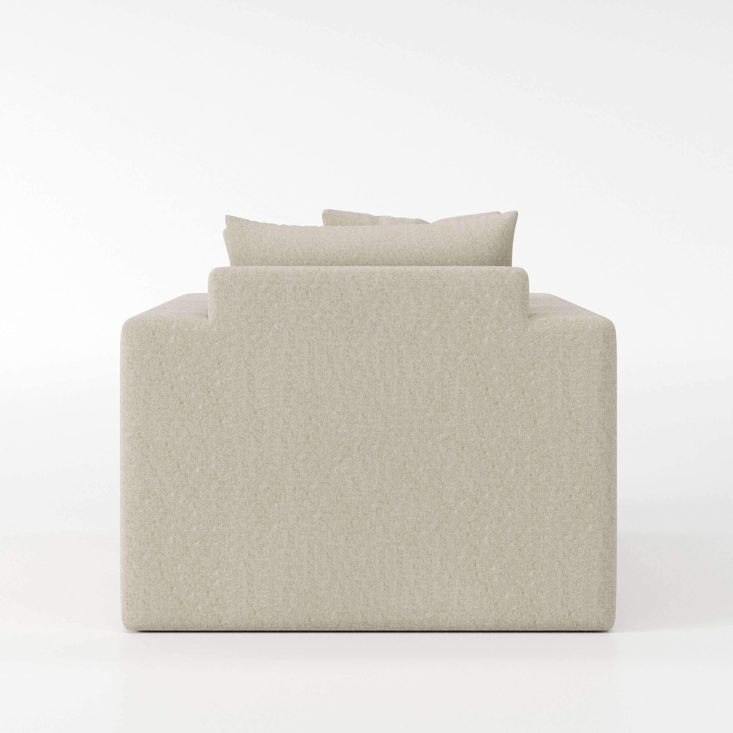Coniston armchair in Alderney Linen Oatmeal shown from the rear highlighting backrest shape and upholstery finish.