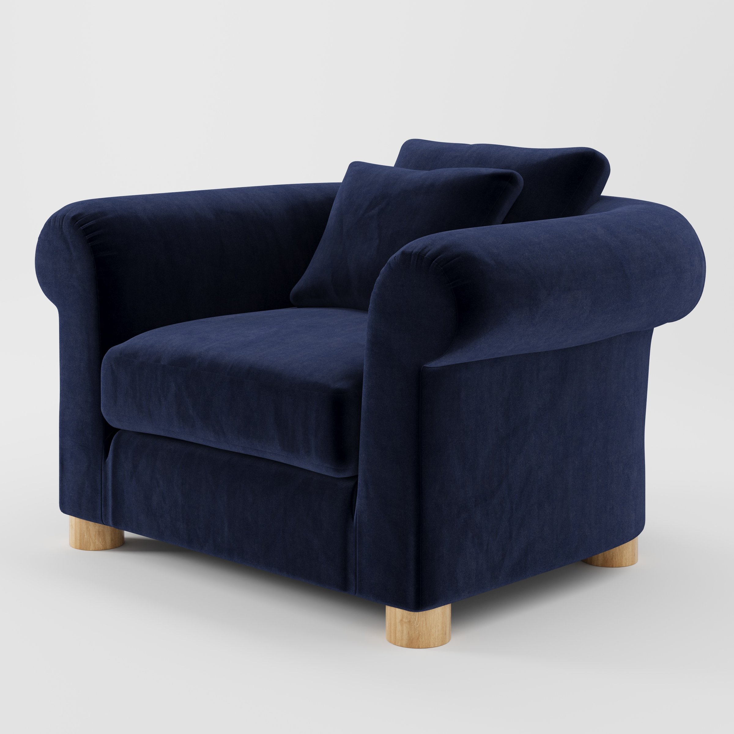 Windermere armchair in Noss Velvet Navy shown at a diagonal angle highlighting rounded arms and relaxed seat depth.