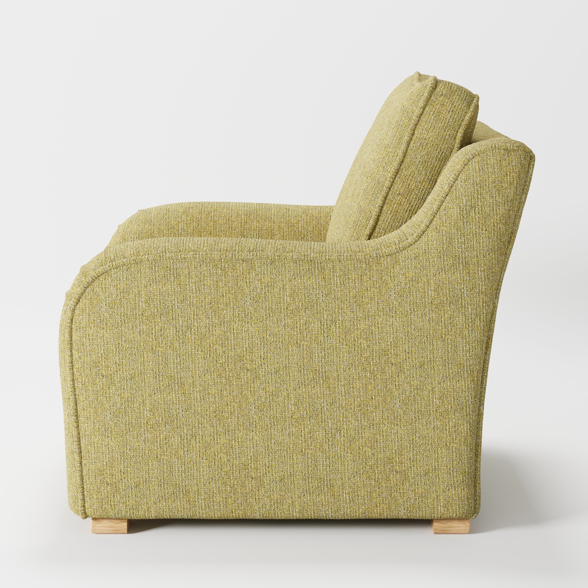 Cashel armchair in Heyling Tweed Sencha shown in side profile displaying proportions and overall silhouette.