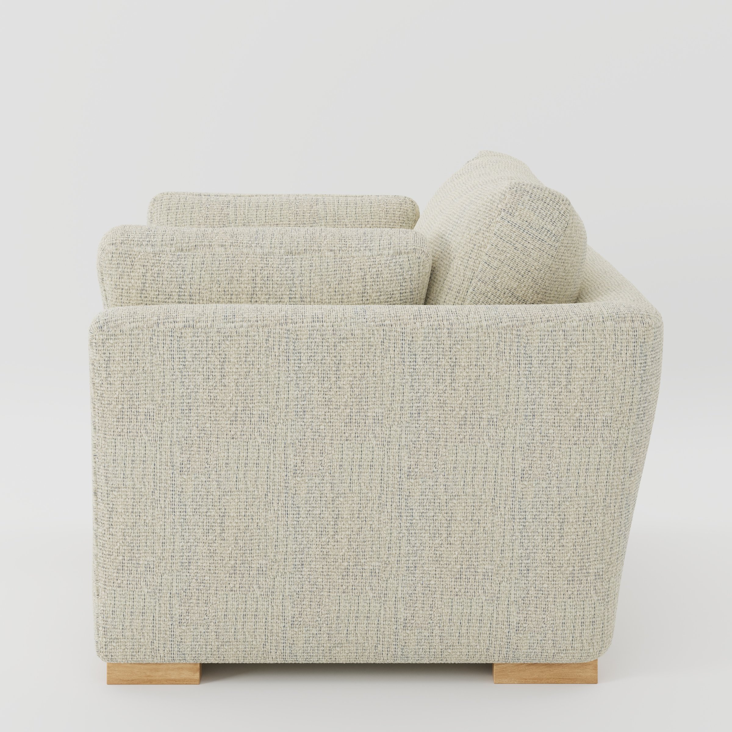 Stowe armchair in Orsay Boucle Cream and Marine shown in side profile displaying proportions and overall silhouette.