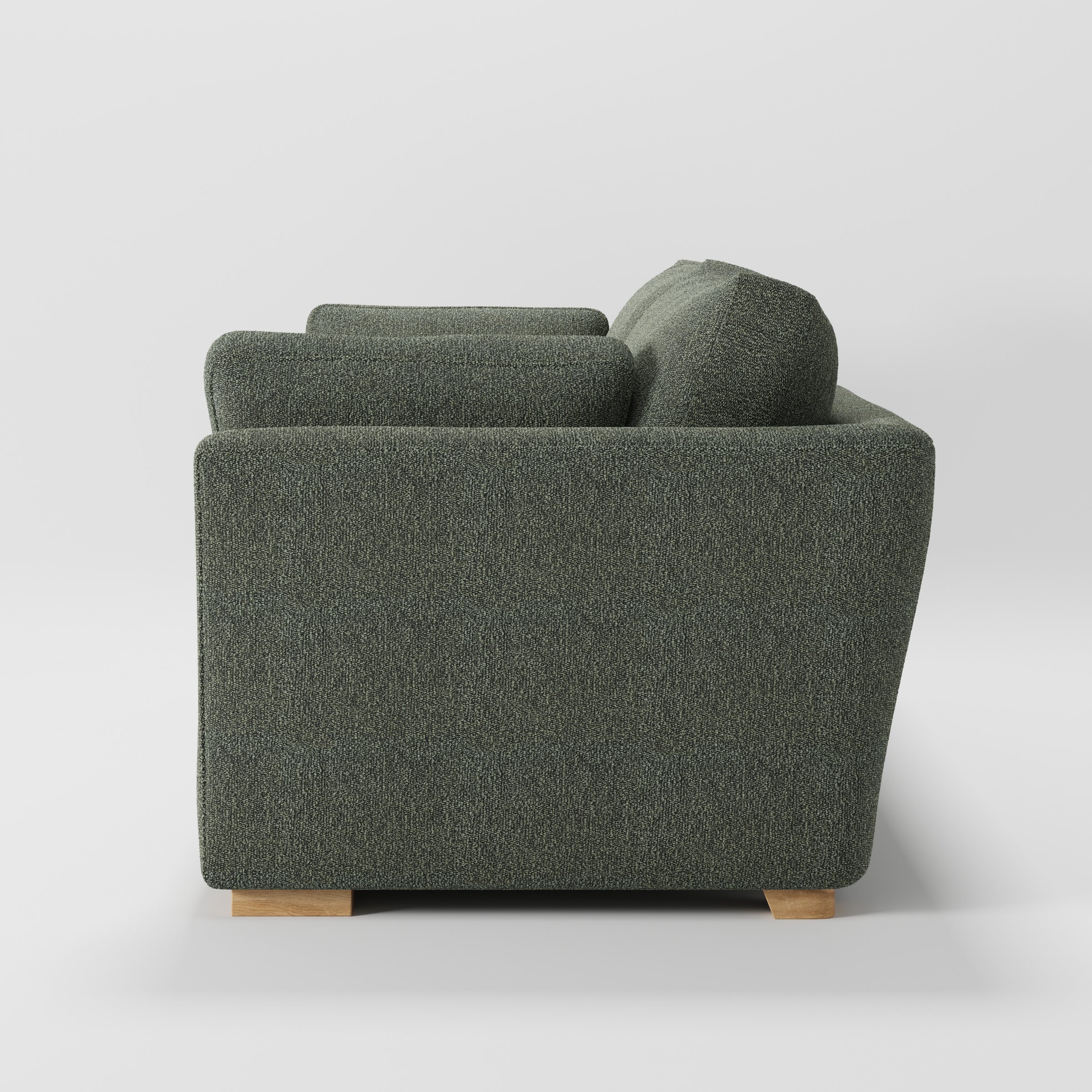 Stowe sofa in Kilda Boucle Moss shown in side profile displaying proportions and overall silhouette.