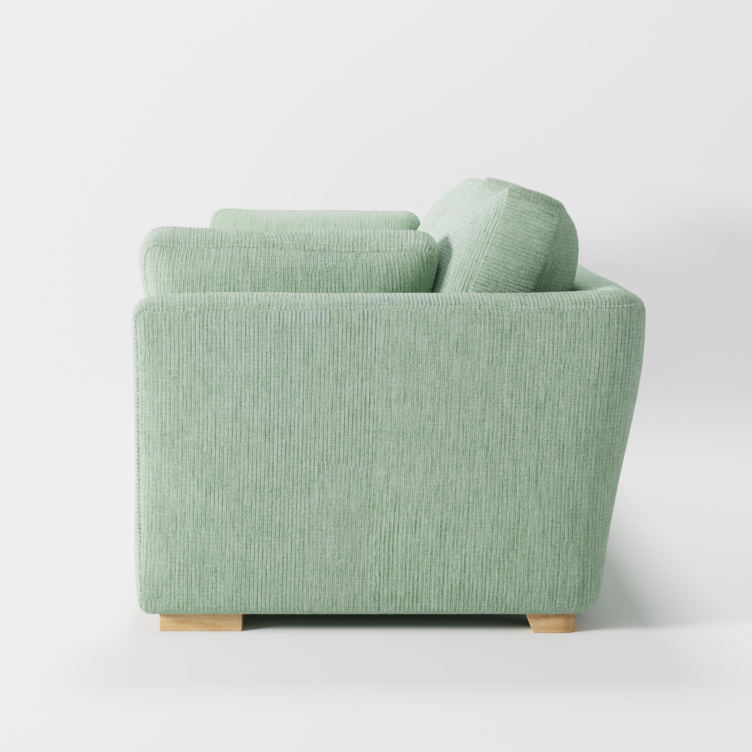 Stowe sofa in Caldey Velvet Corduroy Eucalyptus shown in side profile displaying proportions and overall silhouette.