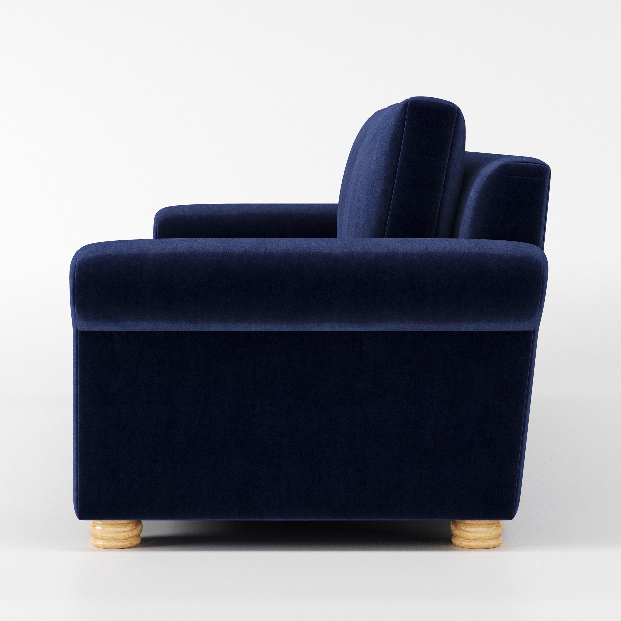 Anna Lee sofa in Noss Velvet Navy shown in side profile displaying proportions and overall silhouette.