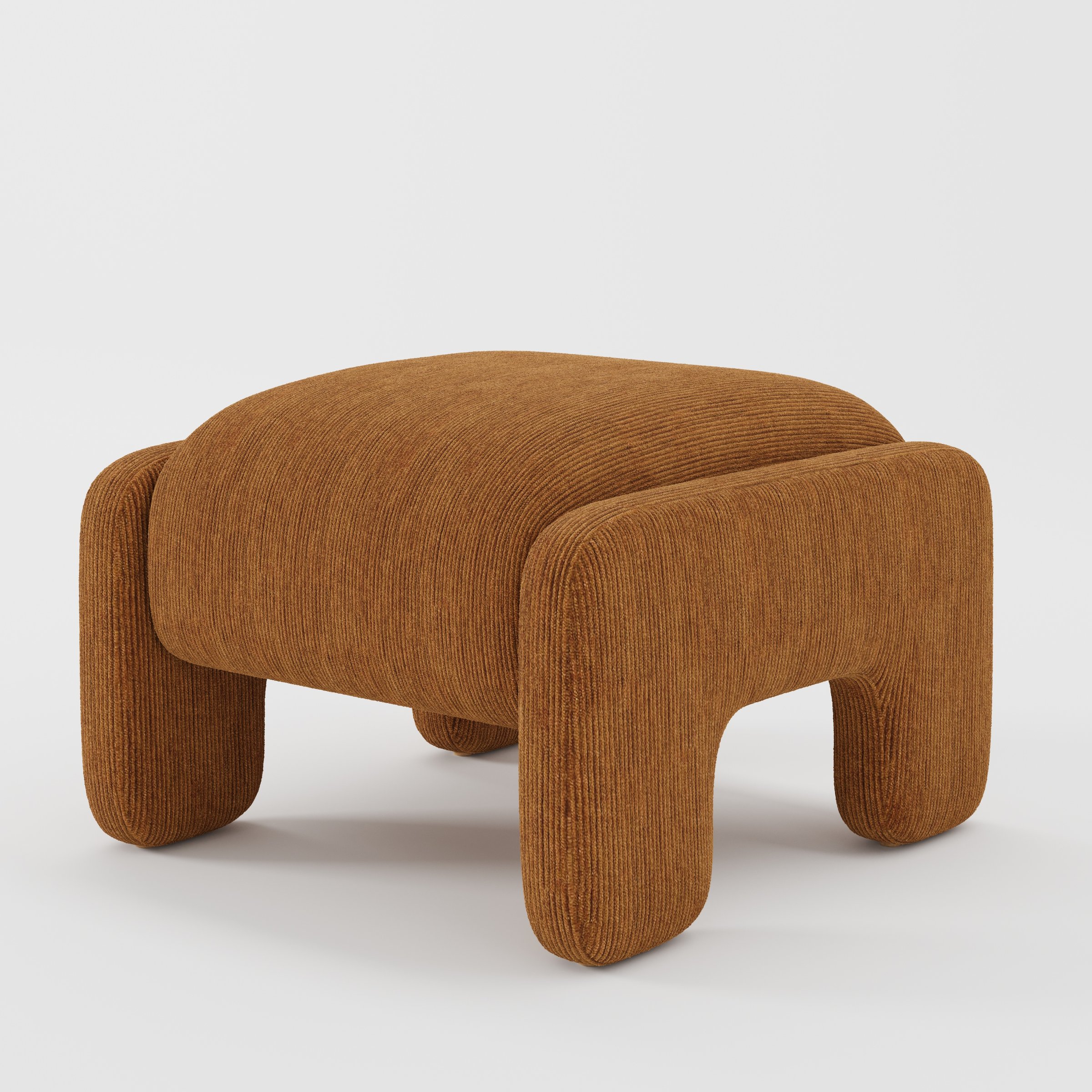 Inny footstool in Caldey velvet corduroy tobacco fabric, diagonal view highlighting curved silhouette and soft corduroy ridges