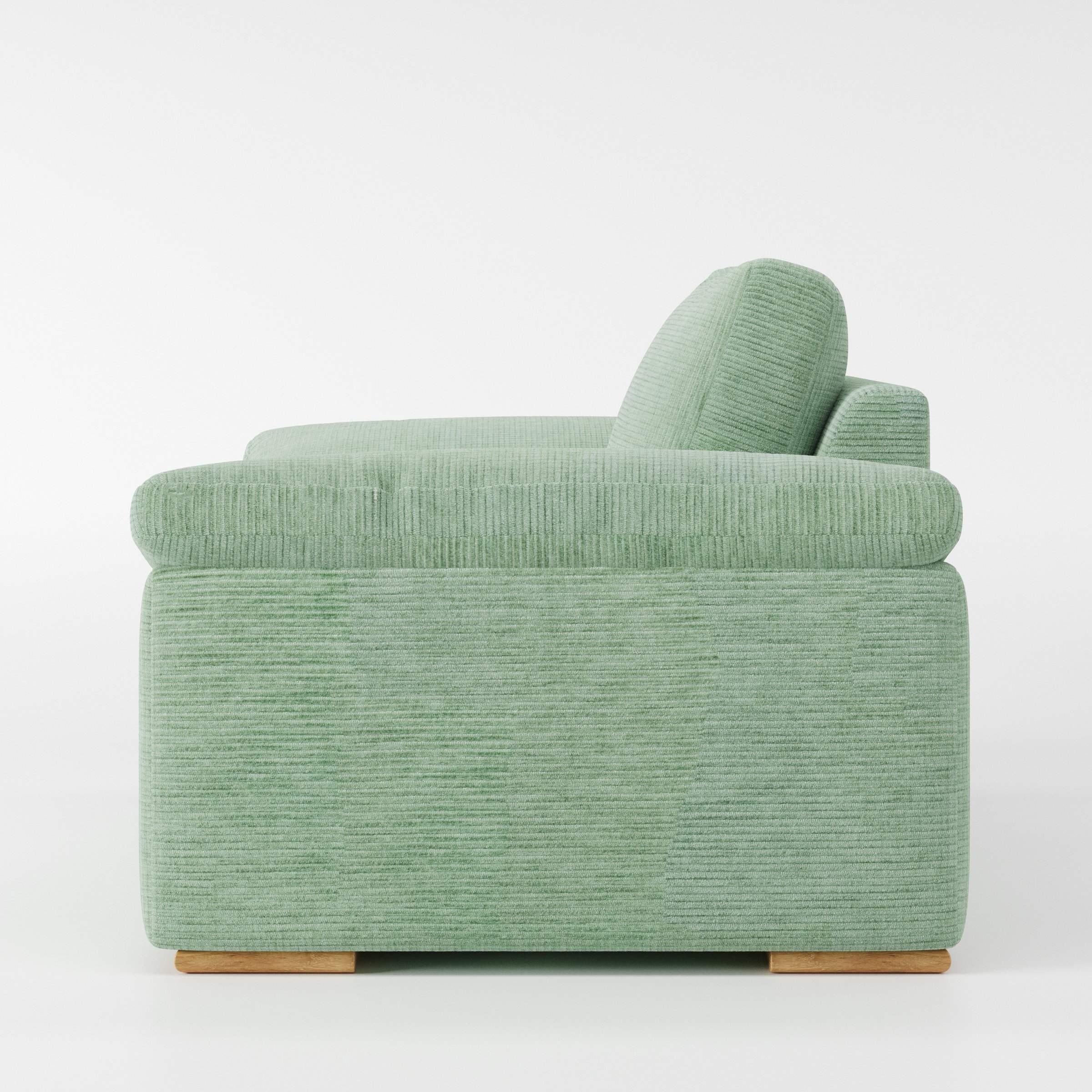 Moy armchair in Caldey Velvet Corduroy Eucalyptus shown in side profile displaying proportions and overall silhouette.