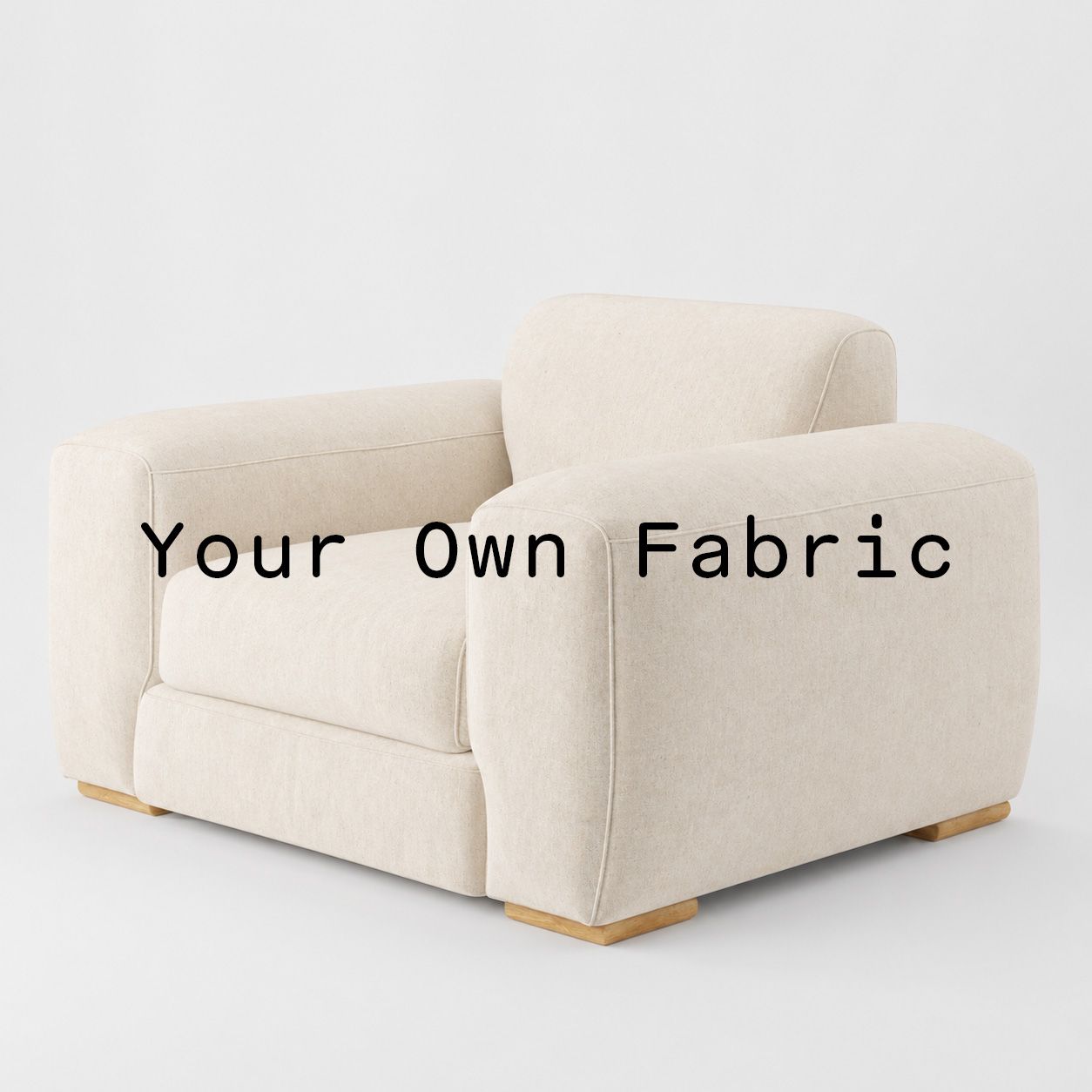Diagonal view of the Darwell armchair upholstered in customers own material calico cotton fabric.