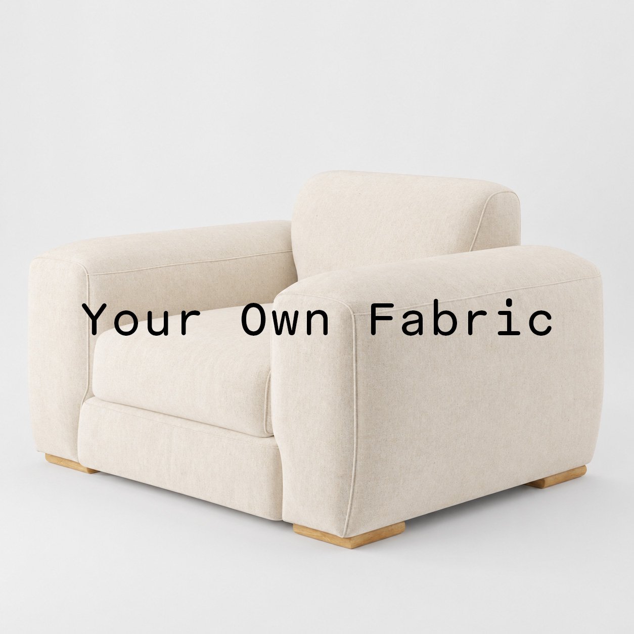 Diagonal view of the Darwell armchair upholstered in customers own material calico cotton fabric.