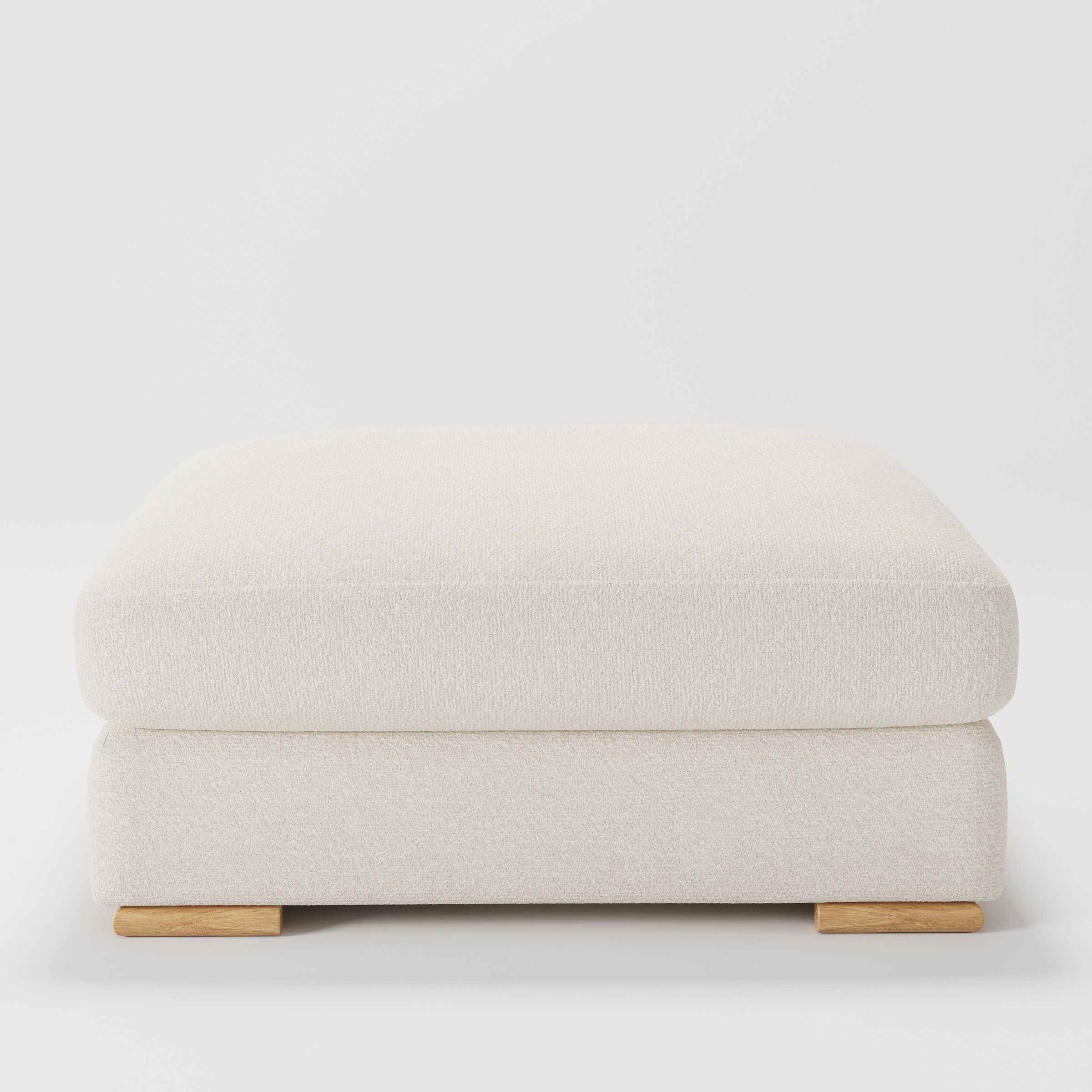 Olton footstool in Kilda Boucle Cream shown front-on against a neutral studio backdrop.