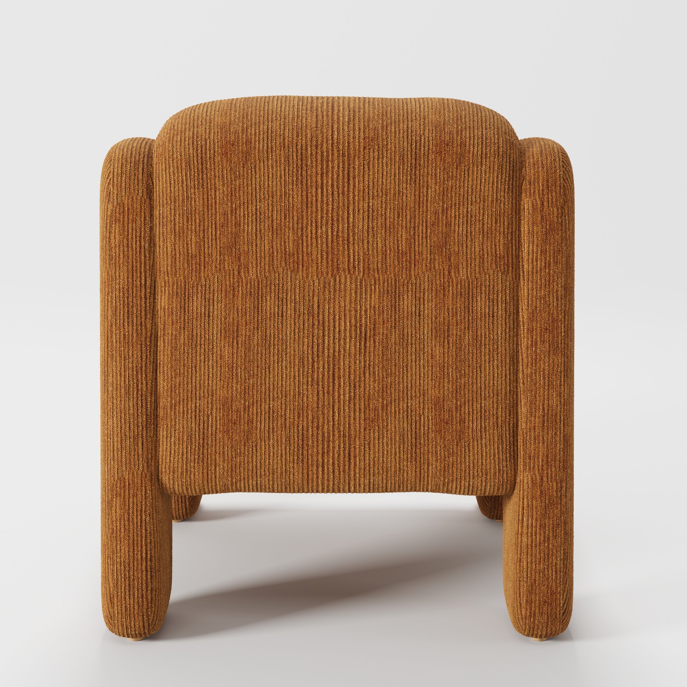 Inny armchair in Caldey Velvet Corduroy Tobacco shown from the rear highlighting curved backrest and upholstery finish.
