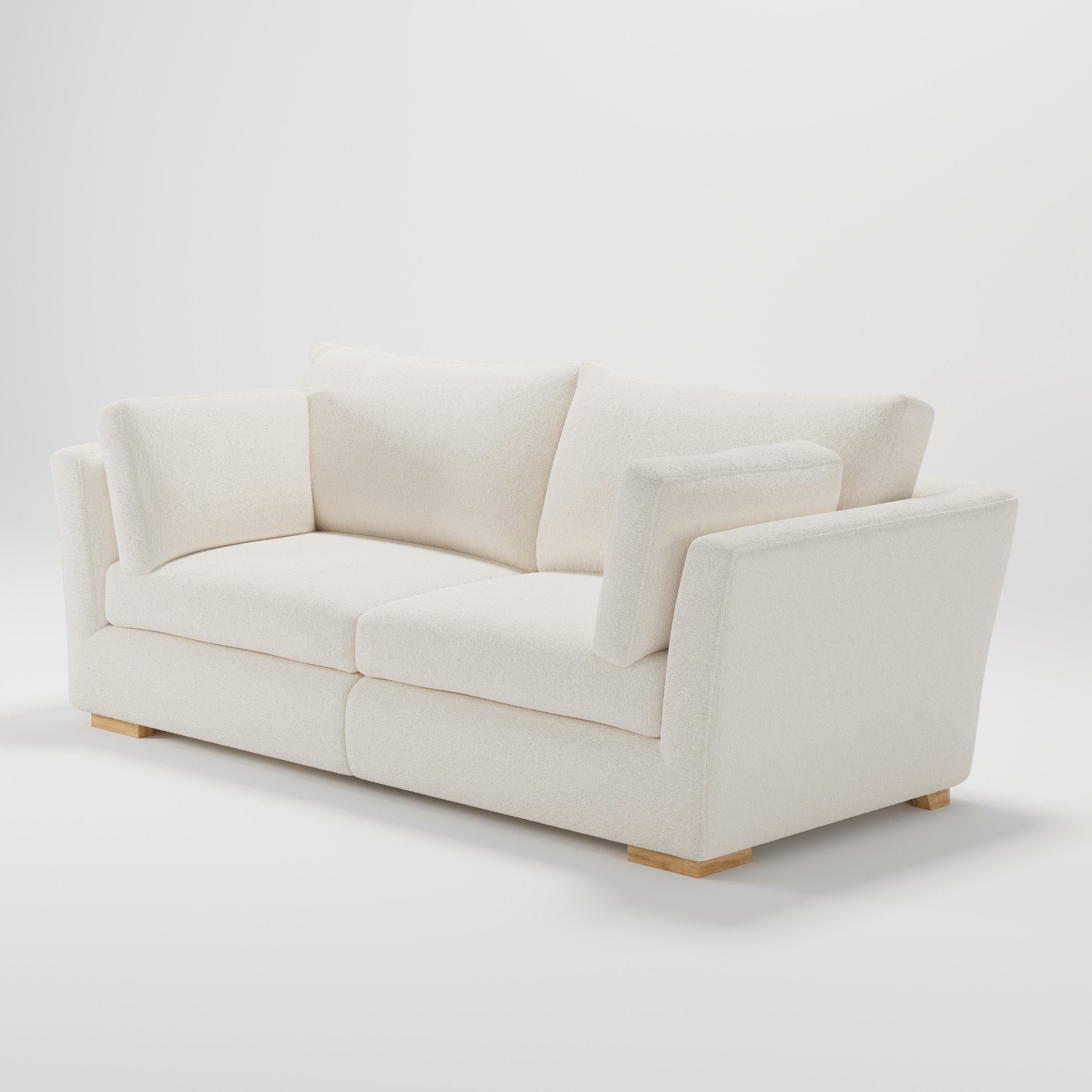 Stowe sofa in Kilda Boucle Cream shown at a diagonal angle highlighting arm profile and seat depth.