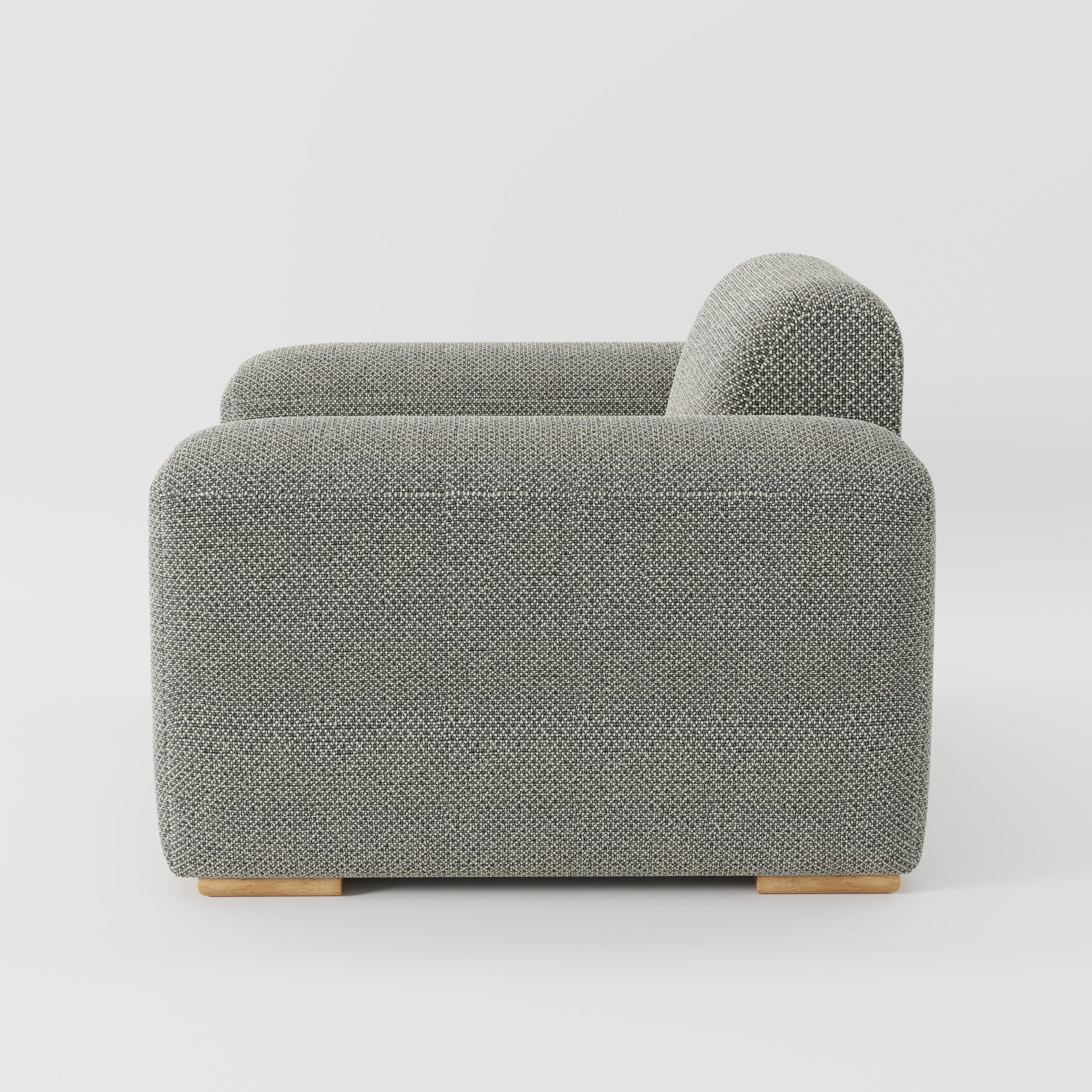 Darwell armchair in Rousay Wool Blend Tar and Chalk shown in side profile displaying proportions and overall silhouette.