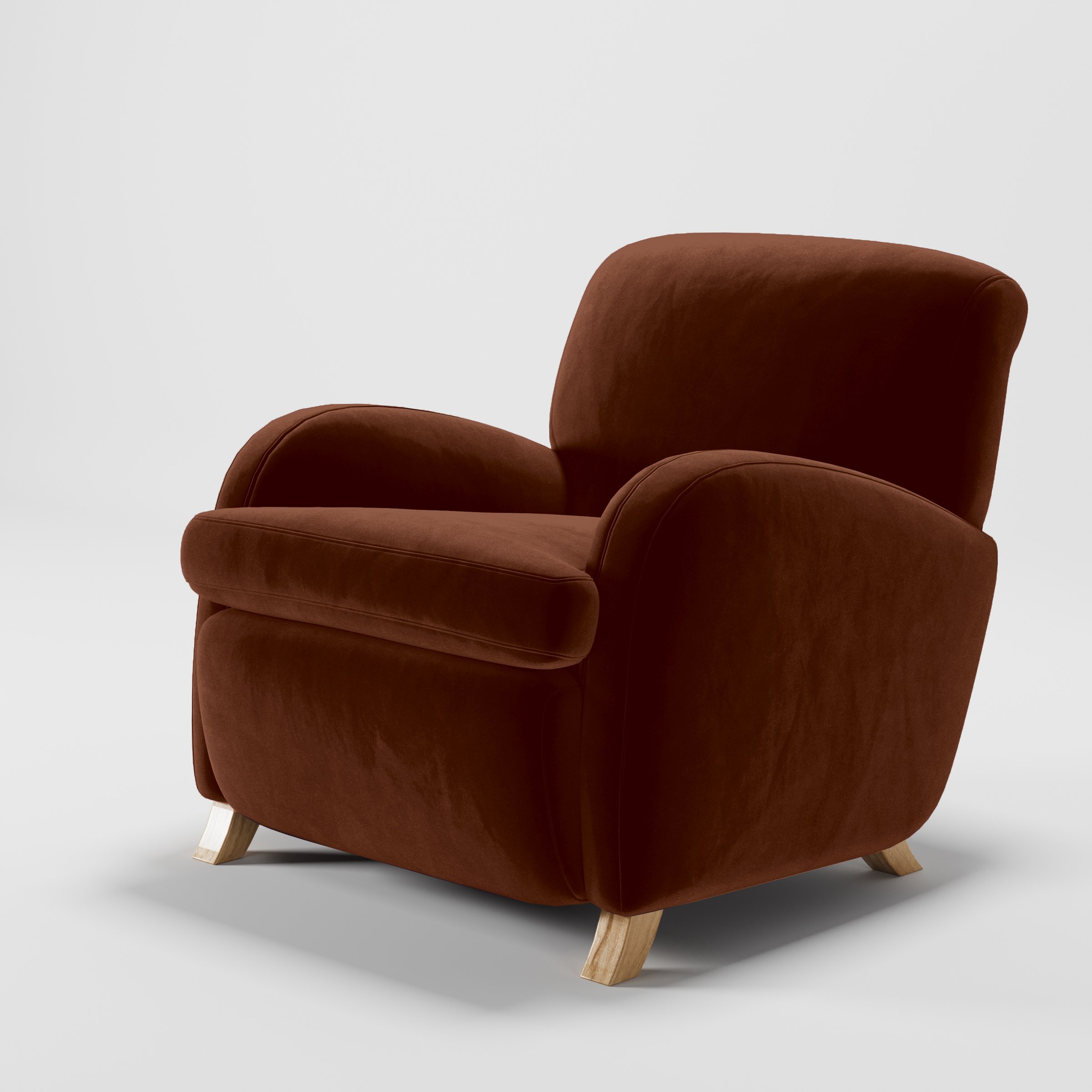 Diagonal view of the Rye armchair upholstered in Plush EasyClean Velvet in Maple.