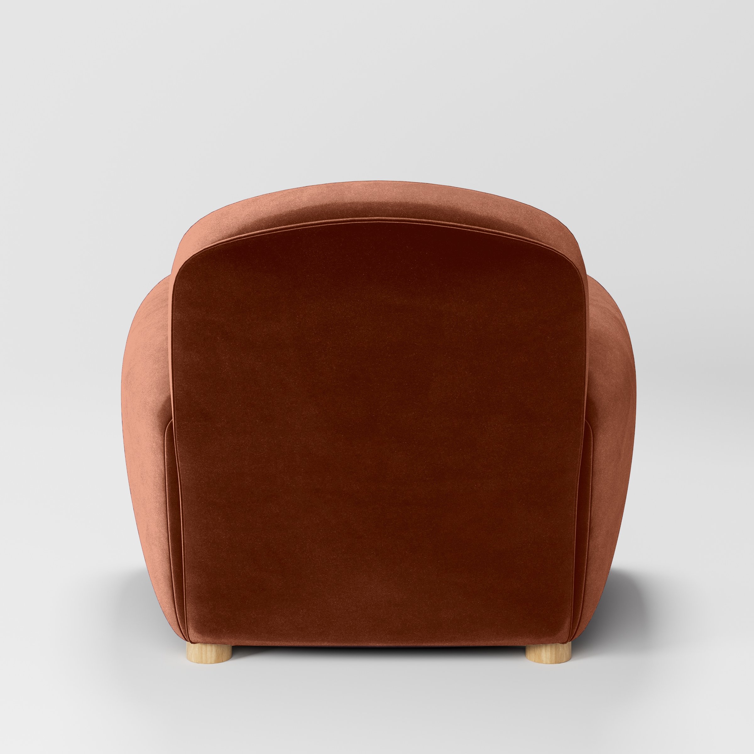 Rear view of the Fergus armchair upholstered in Plush EasyClean Velvet in Apricot.