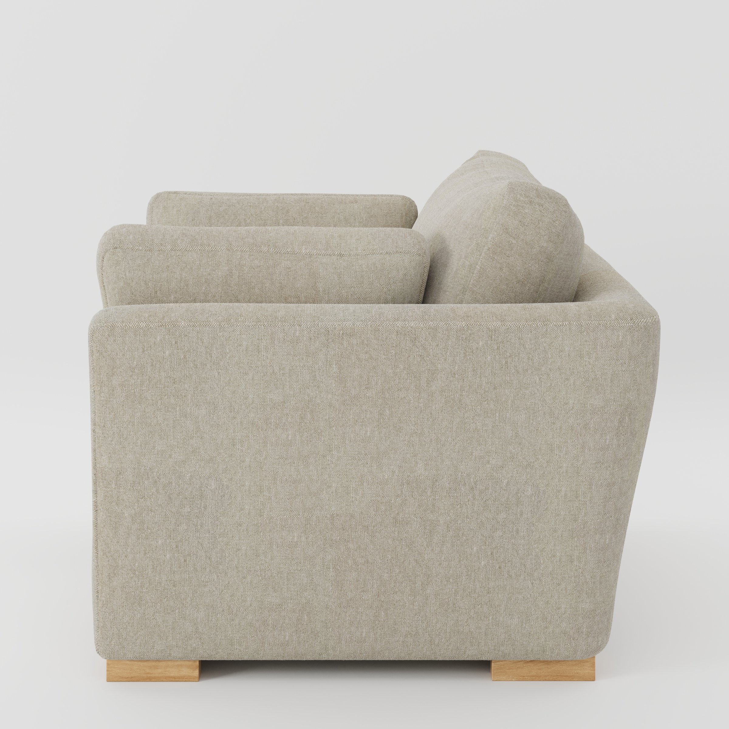 Stowe armchair in Alderney Linen Oatmeal shown in side profile displaying proportions and overall silhouette.