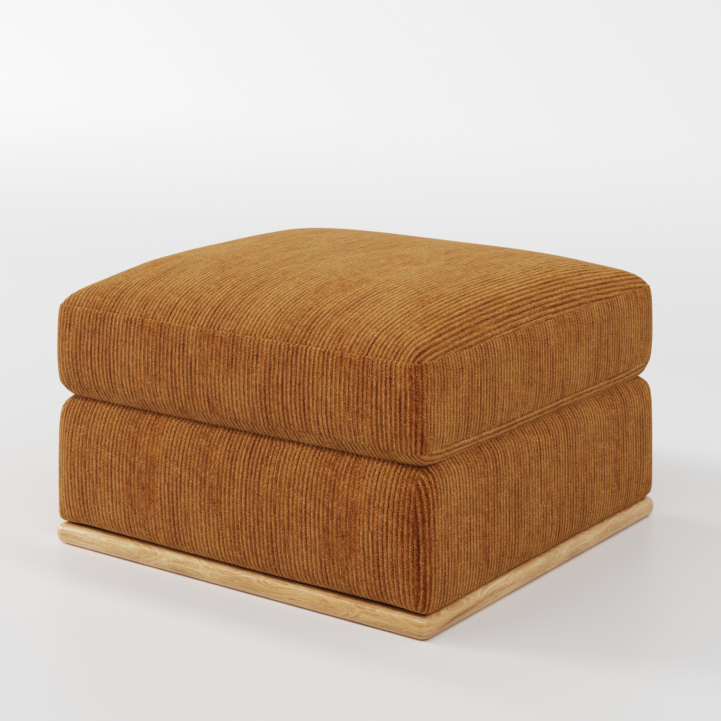 Cusher footstool in Caldey Velvet Corduroy Tobacco shown at a diagonal angle highlighting structured form and wooden plinth base.