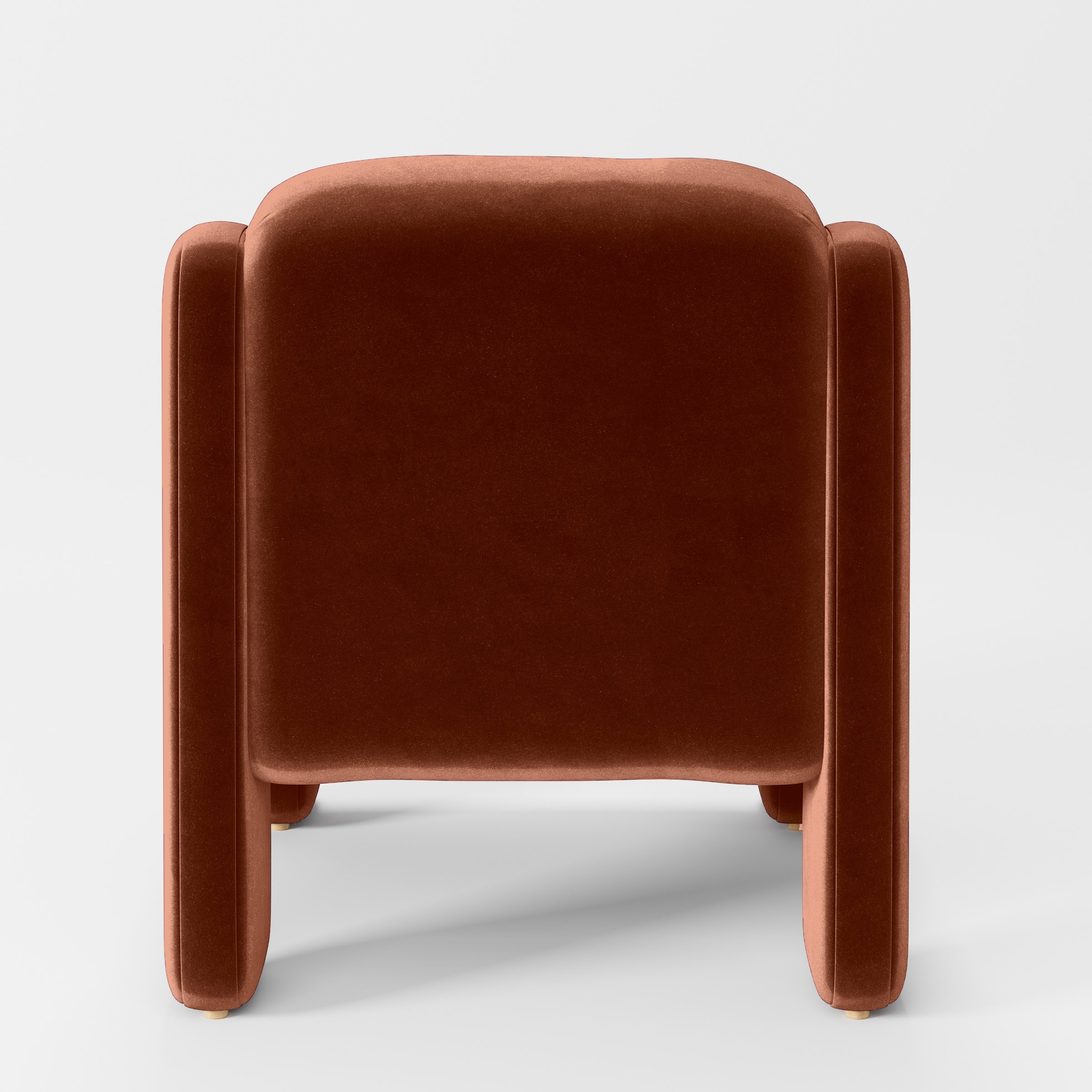Rear view of the Inny armchair upholstered in Plush EasyClean Velvet in Apricot.