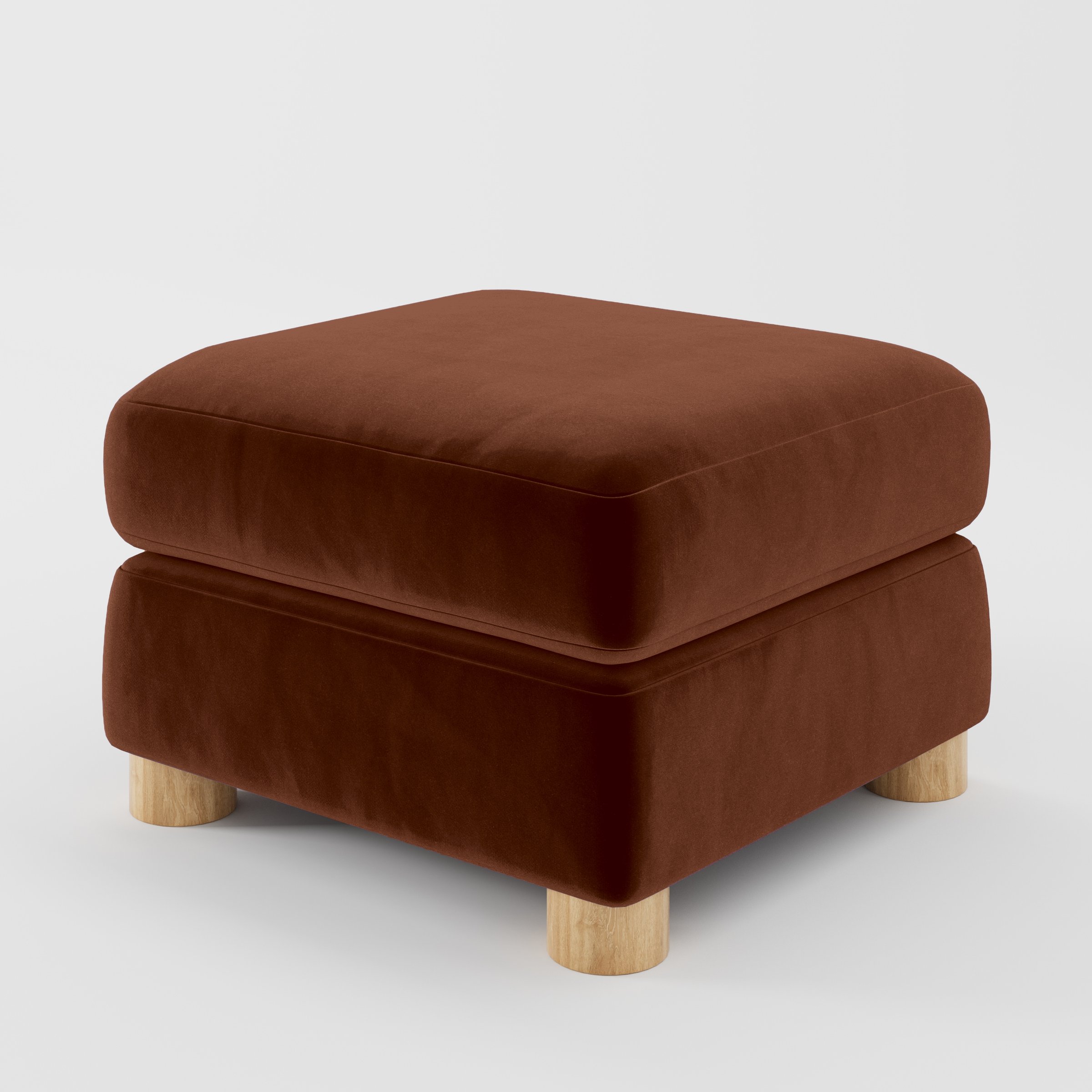 Diagonal view of the Windermere footstool upholstered in Plush EasyClean Velvet in Maple.