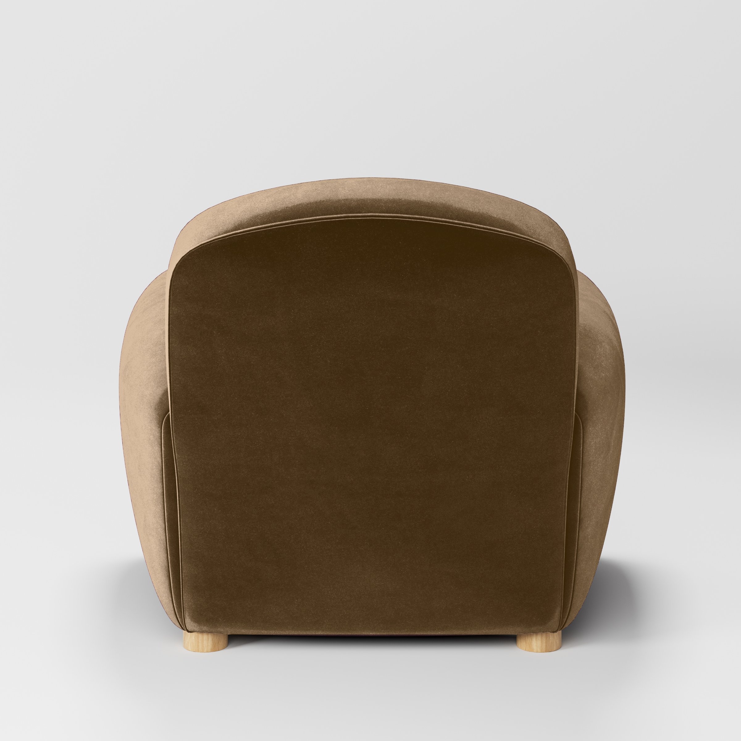 Rear view of the Fergus armchair upholstered in Plush EasyClean Velvet in Caribou.
