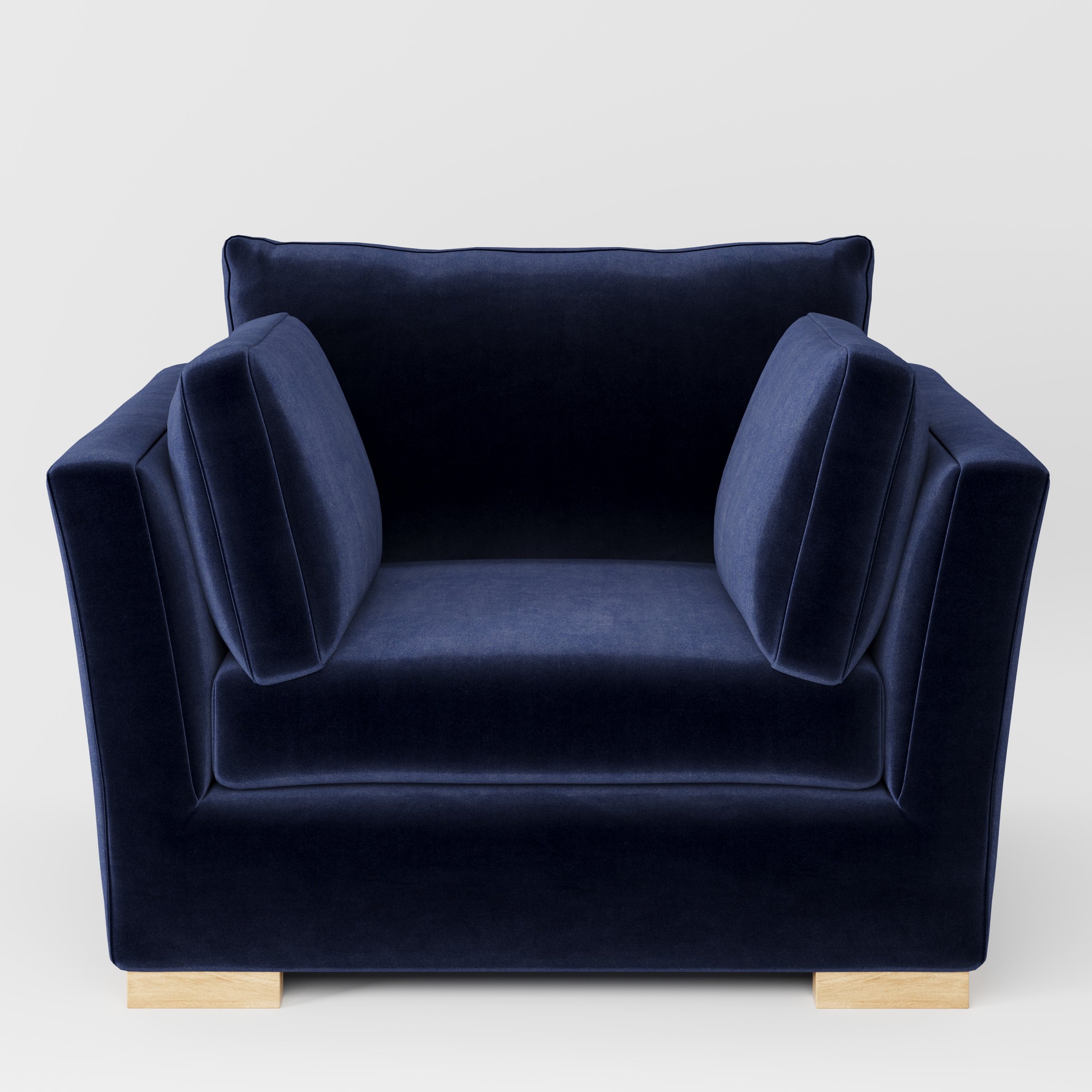 Stowe armchair in Noss Velvet Navy shown front-on against a neutral studio backdrop.